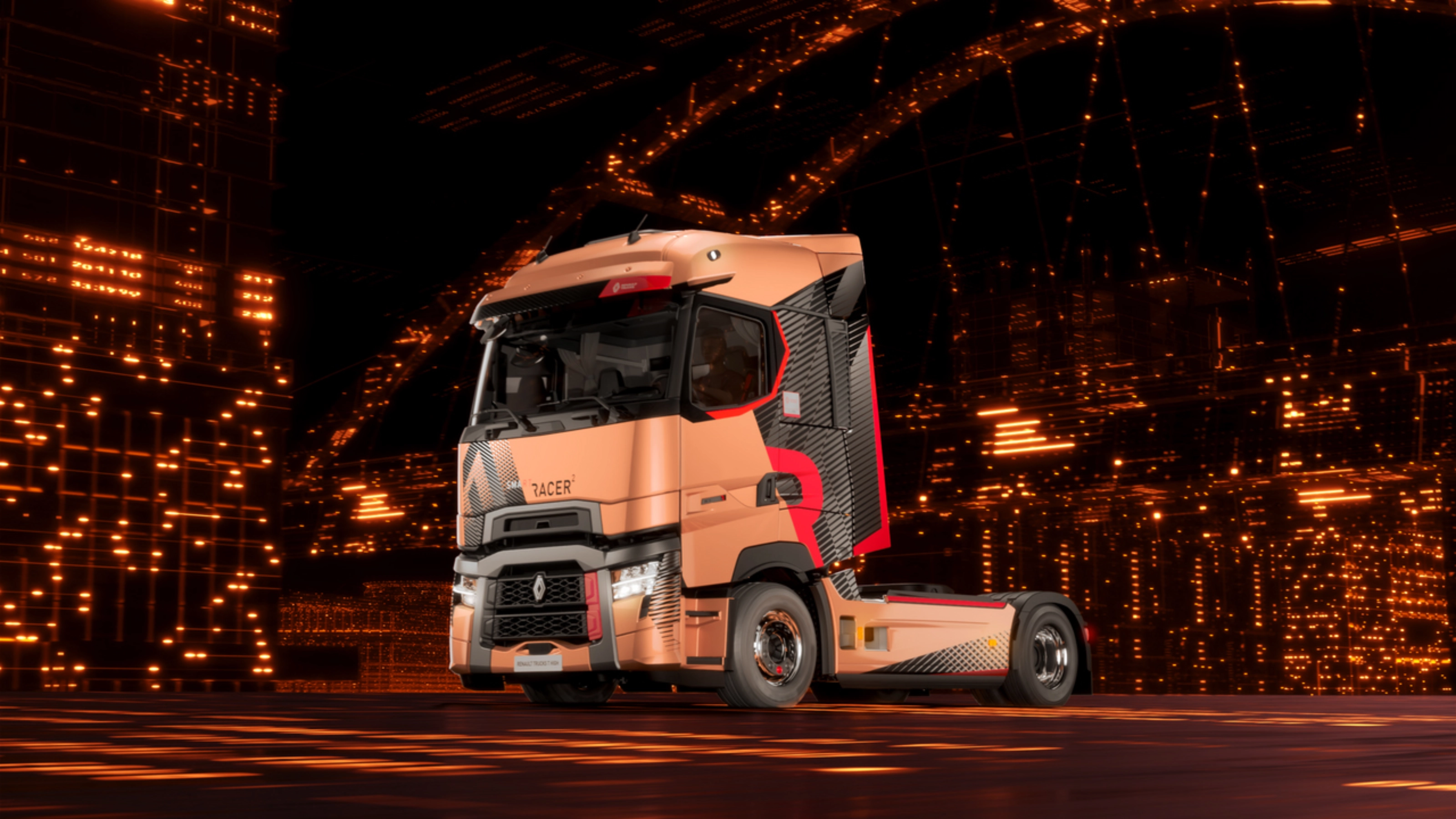 Renault Trucks T High Sattelzugmaschine fährt nachts durch eine Stadt.