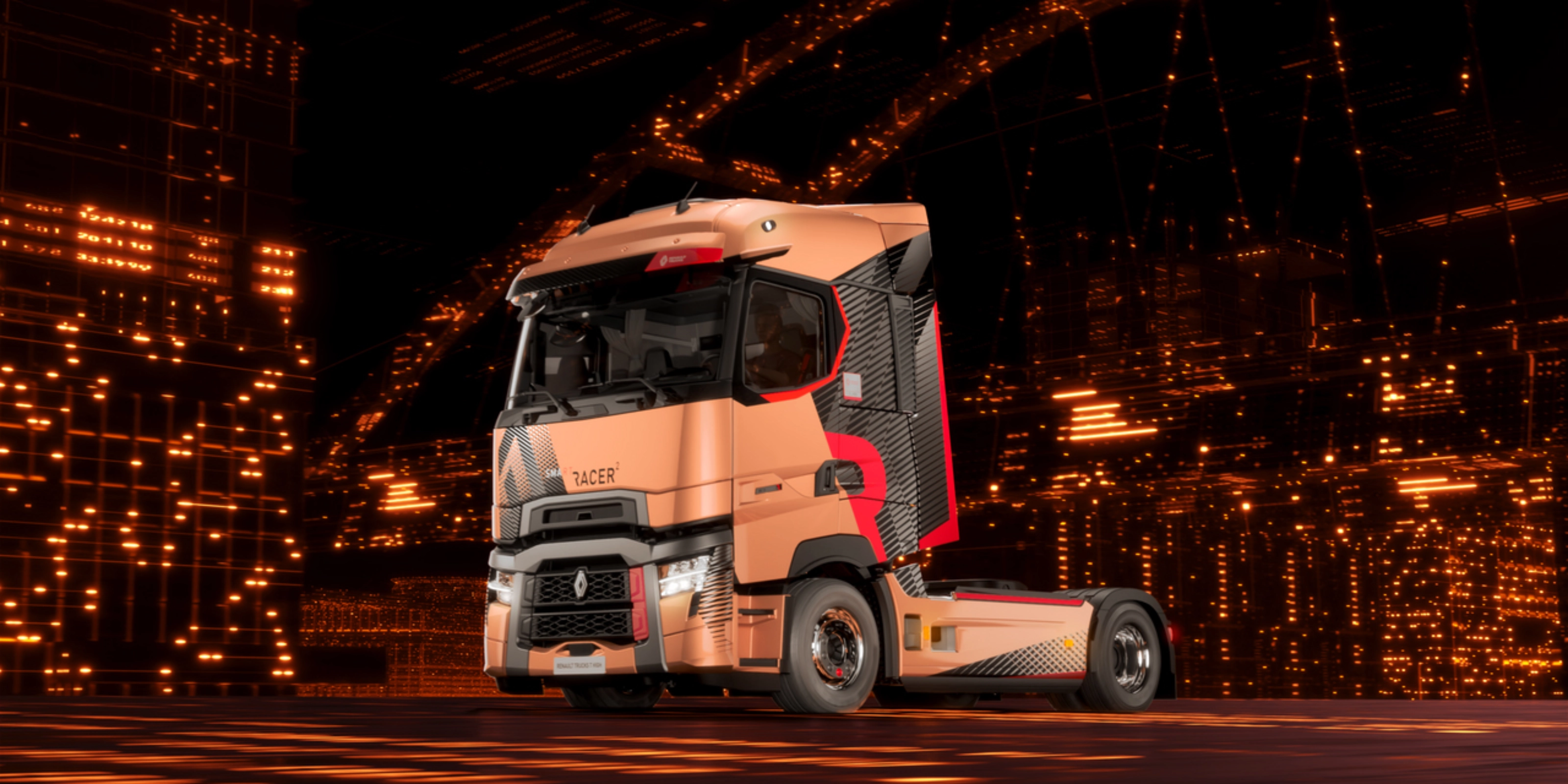 Renault Trucks T High Sattelzugmaschine fährt nachts durch eine Stadt.