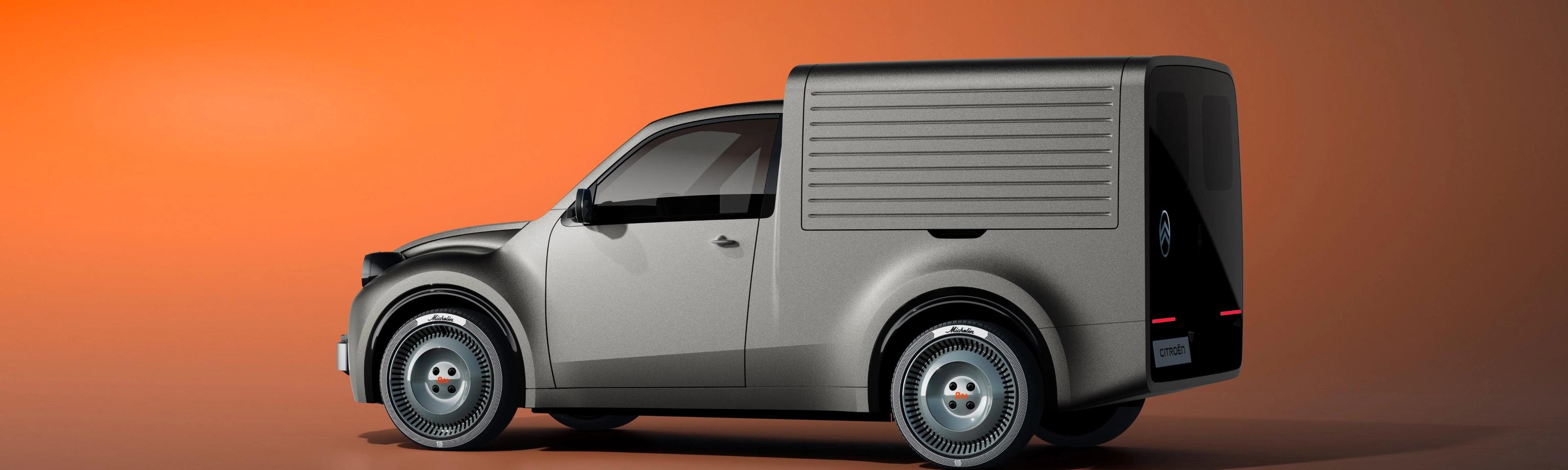 White Citroën delivery van in side view against an orange background.