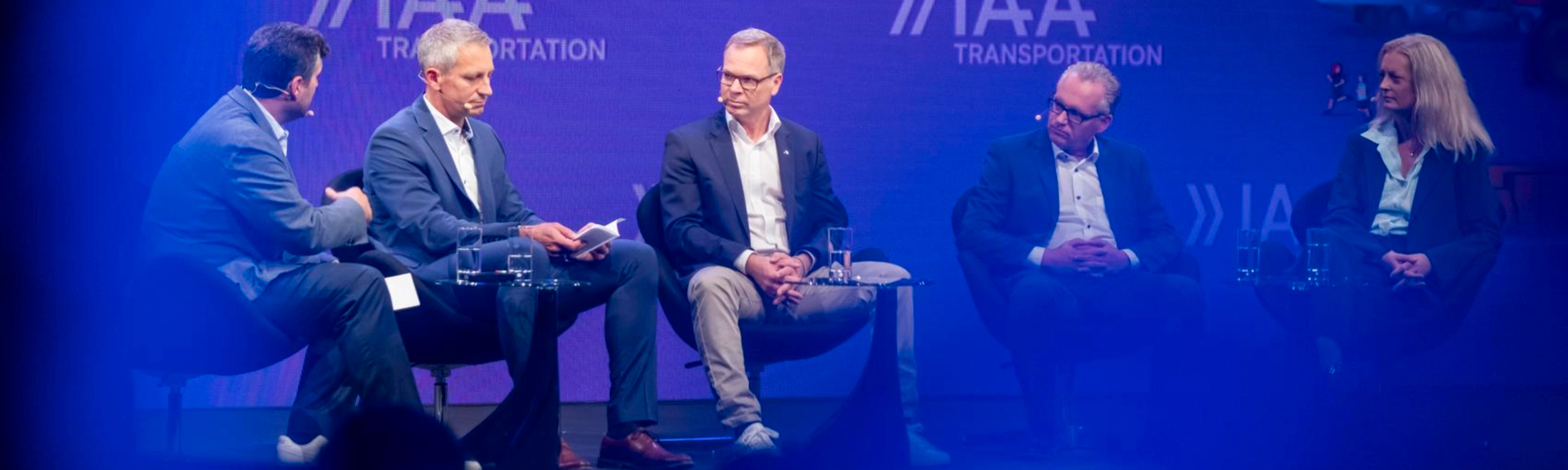 Five participants discuss on stage at IAA Transportation.