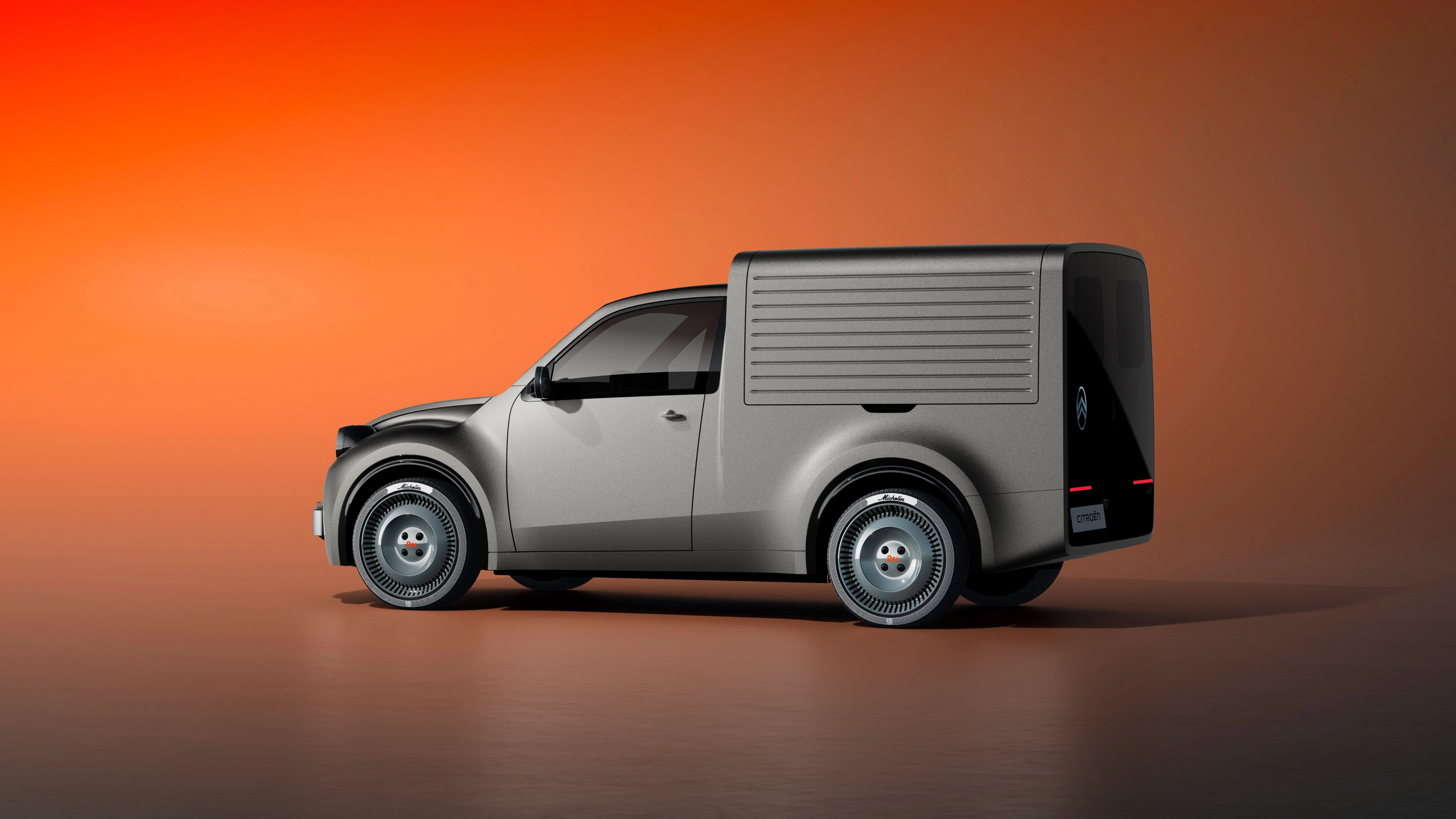 White Citroën delivery van in side view against an orange background.