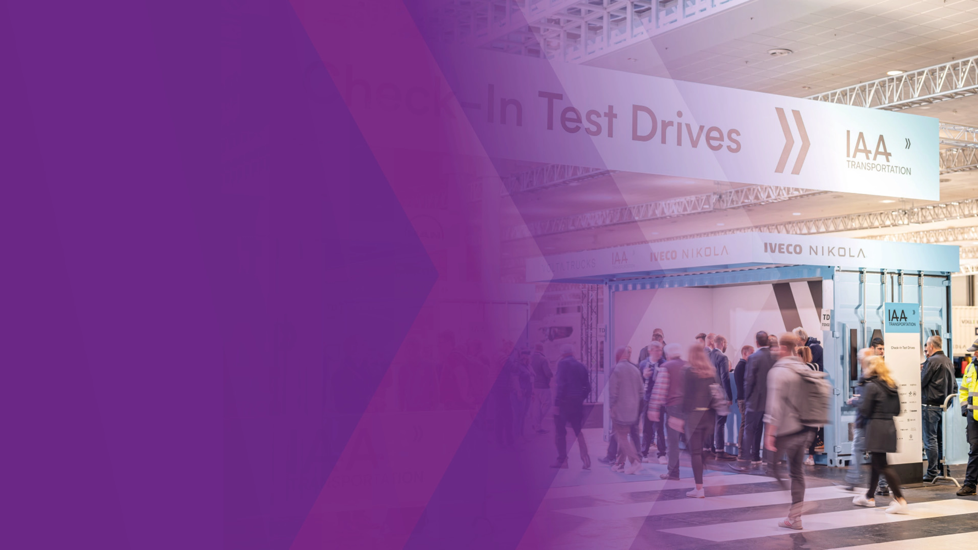 Visitors at IAA check-in area for test drives in exhibition hall.