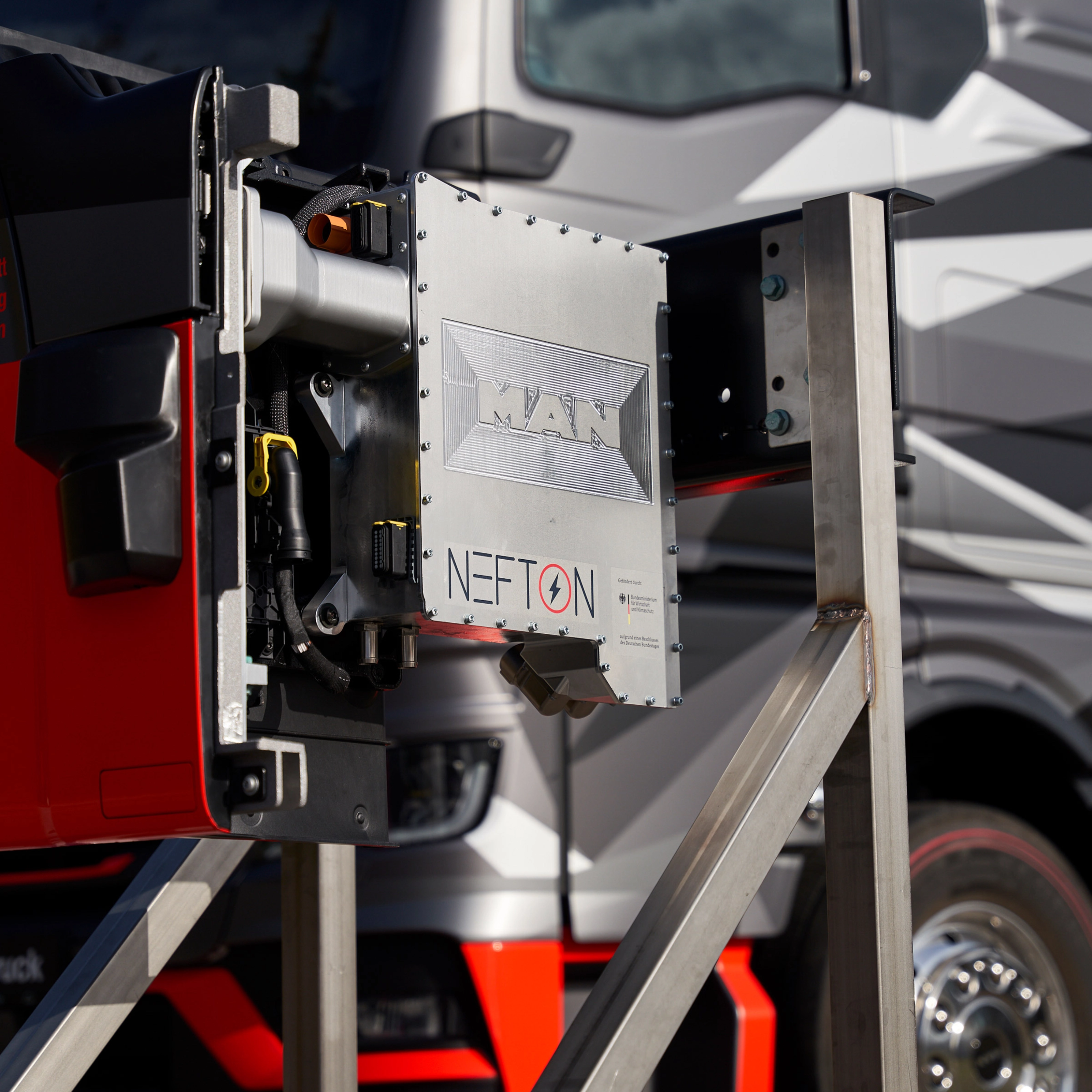 MAN Nefton megawatt charging system mounted in front of an electric truck.