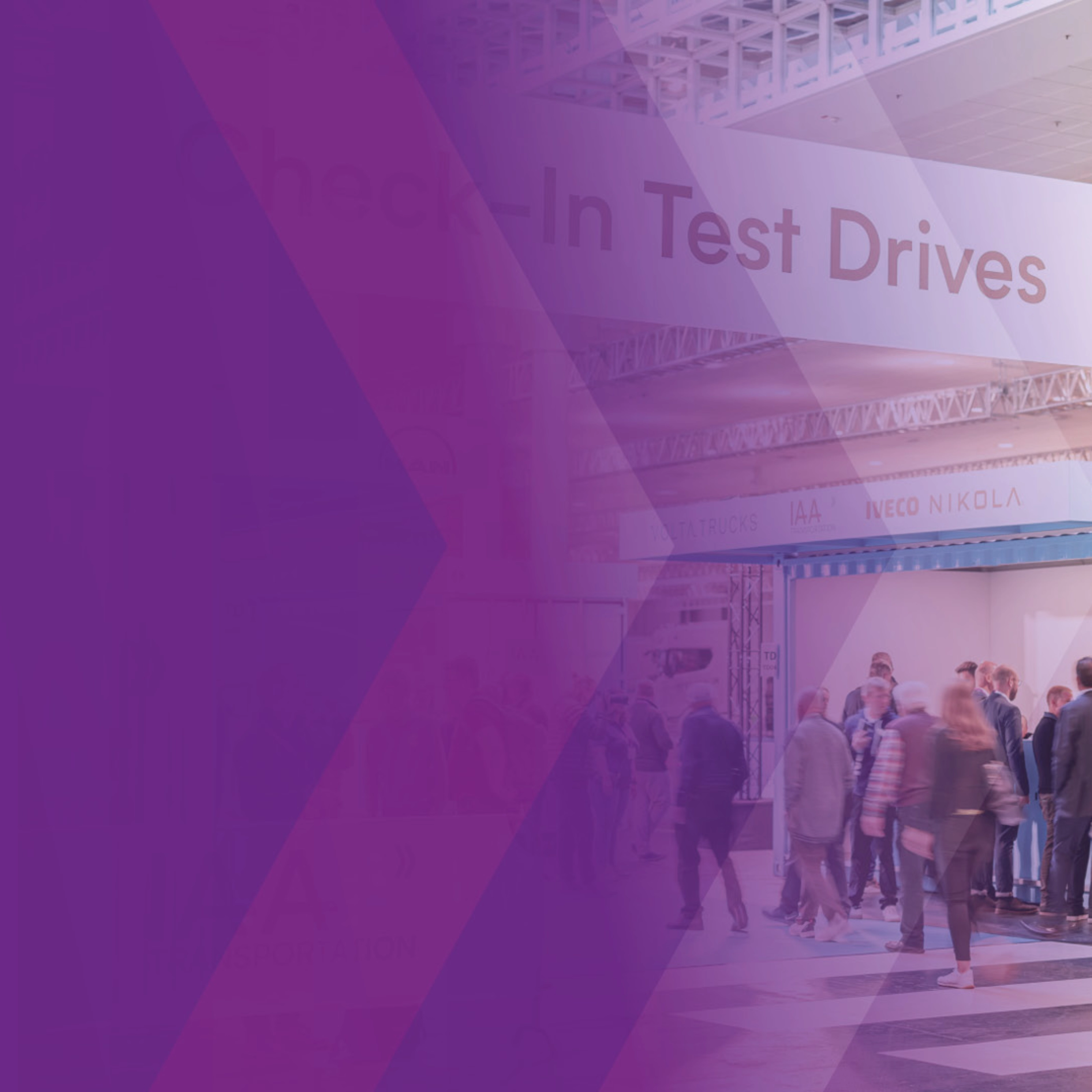 Visitors at IAA check-in area for test drives in exhibition hall.