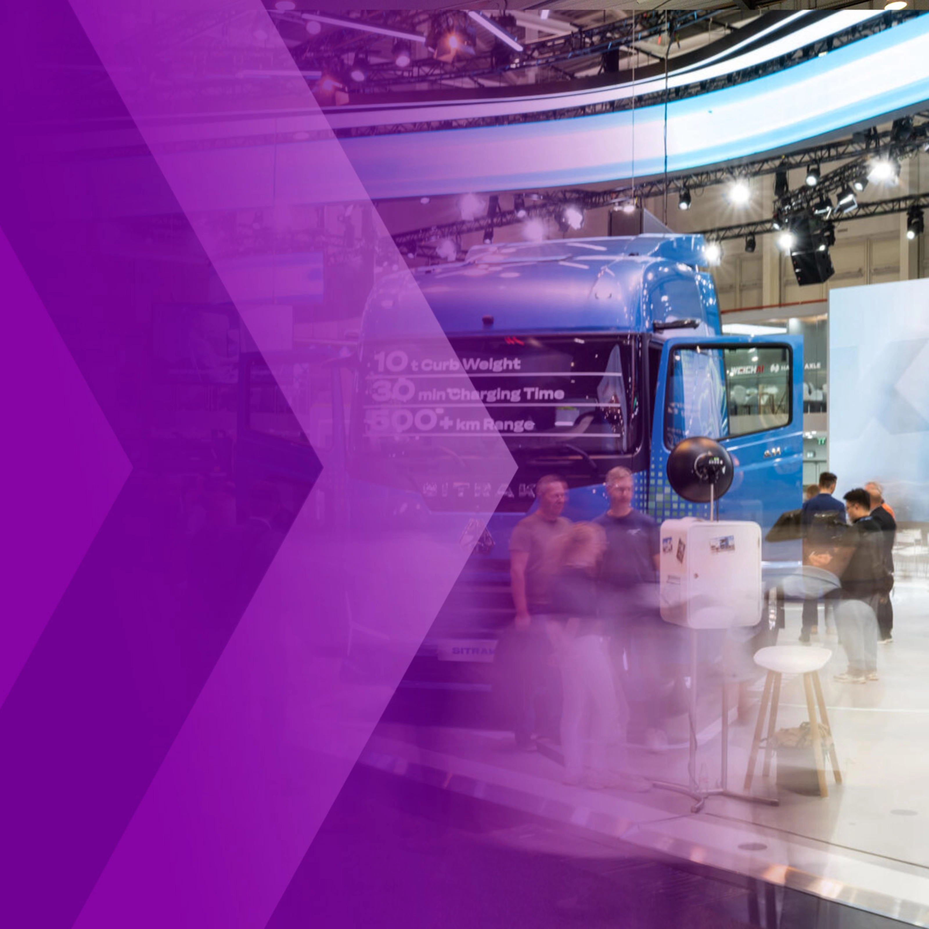Trade show hall with a blue truck, visitors and a purple arrow graphic.