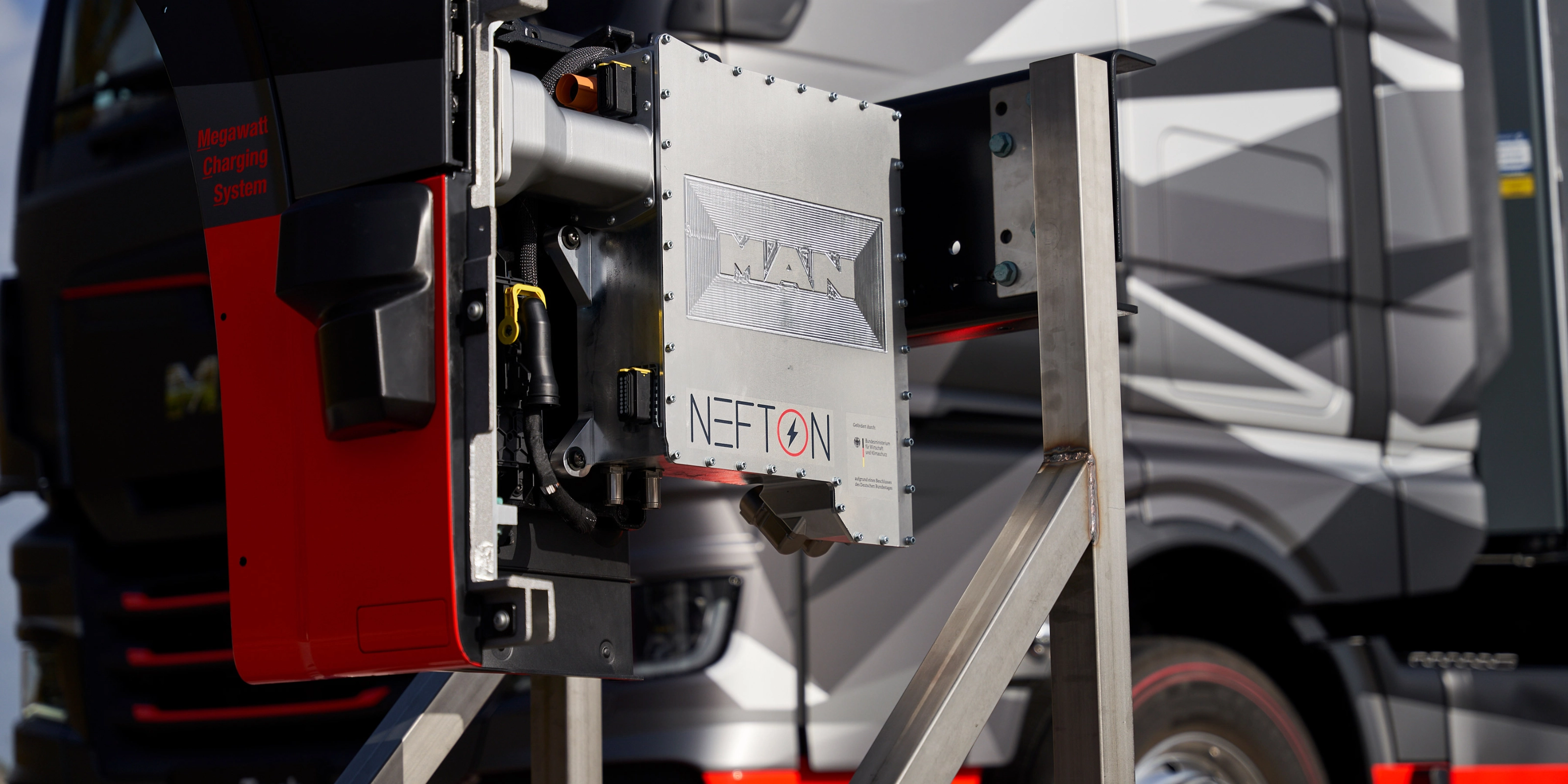 MAN Nefton megawatt charging system mounted in front of an electric truck.