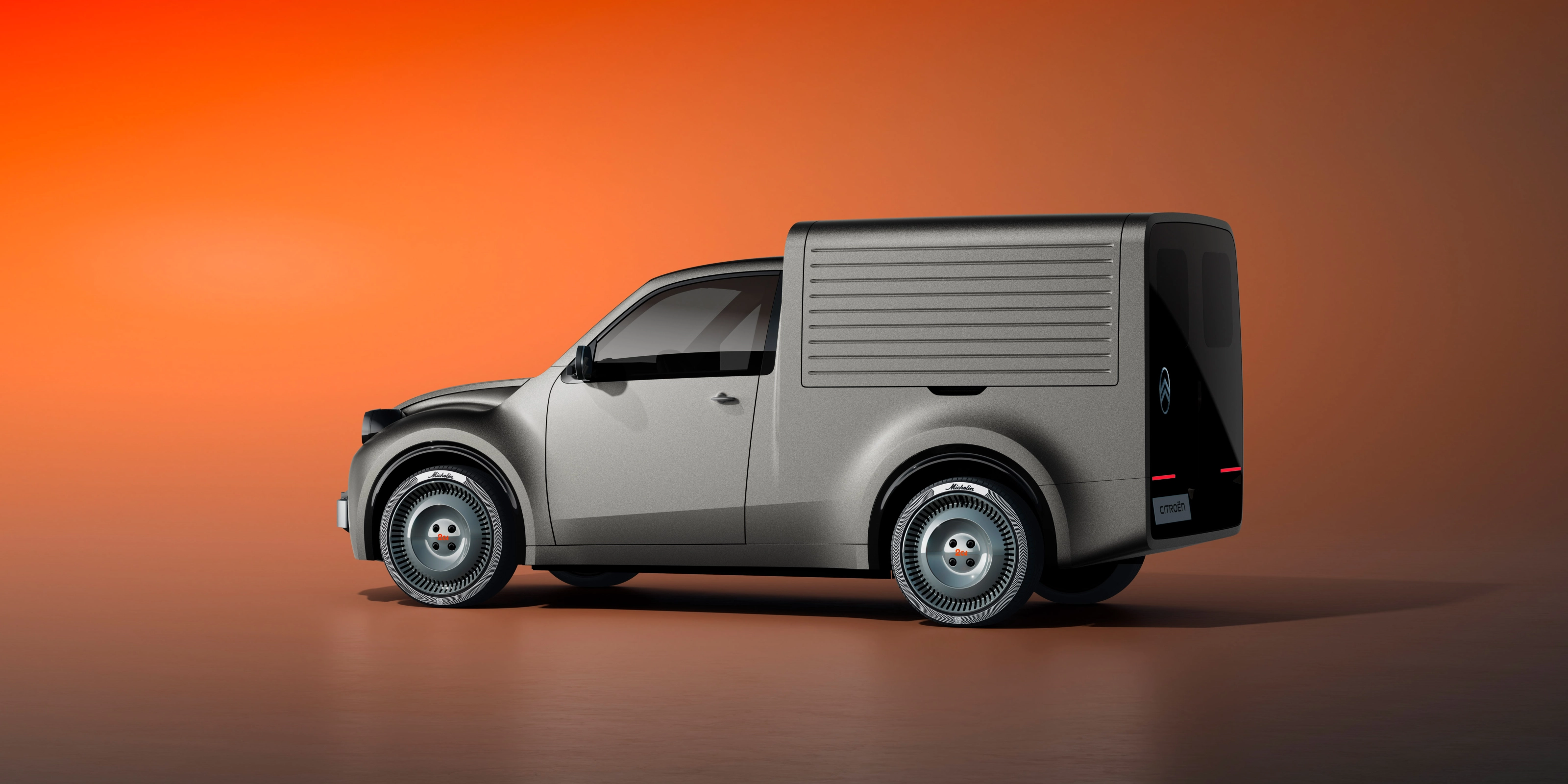 White Citroën delivery van in side view against an orange background.