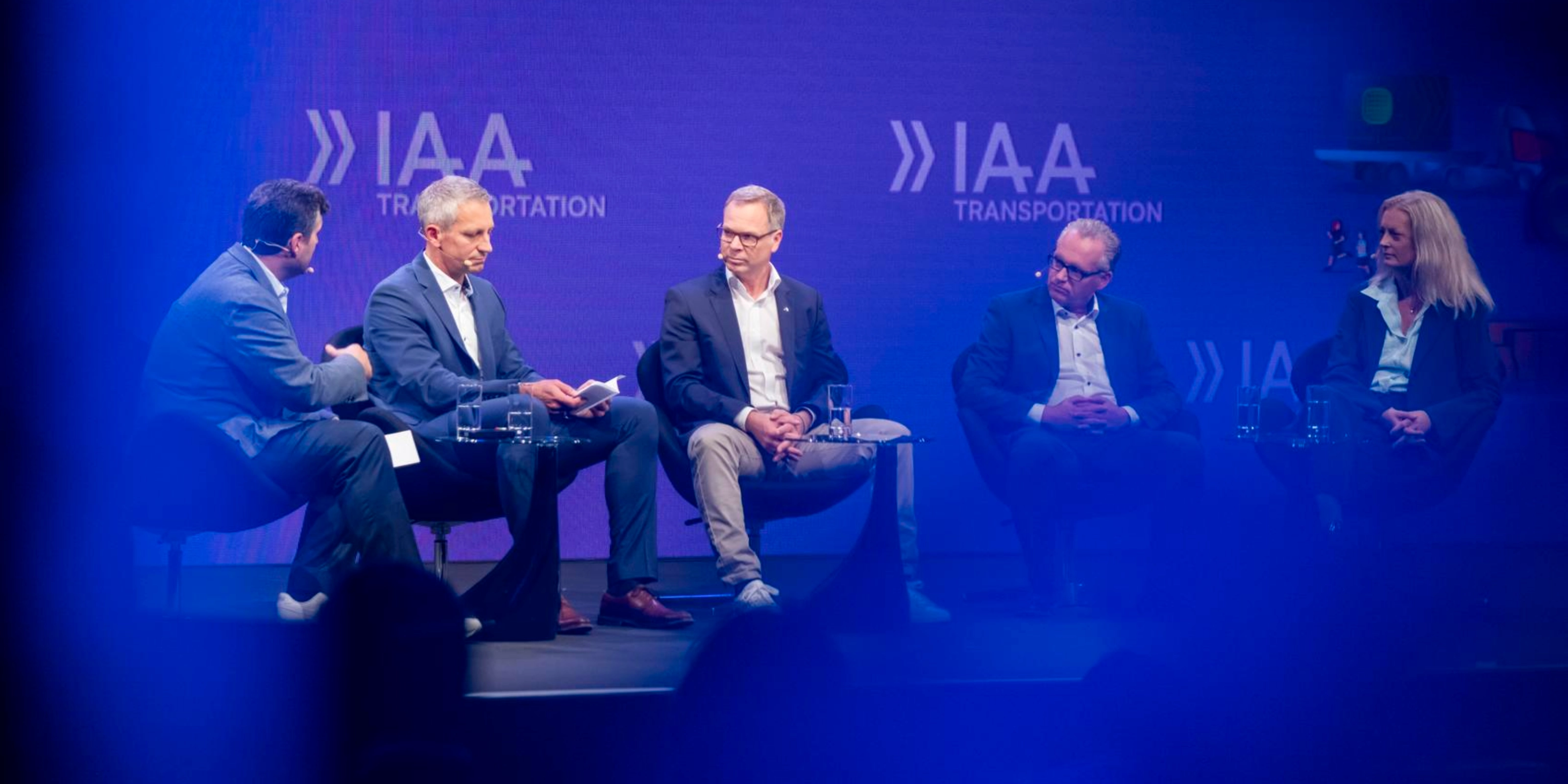 Five participants discuss on stage at IAA Transportation.