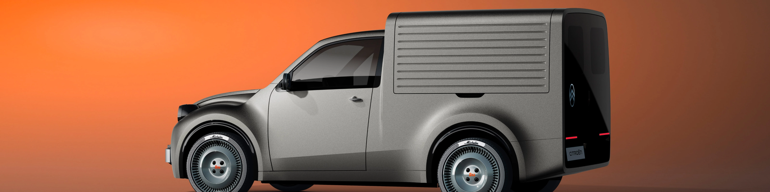 White Citroën delivery van in side view against an orange background.