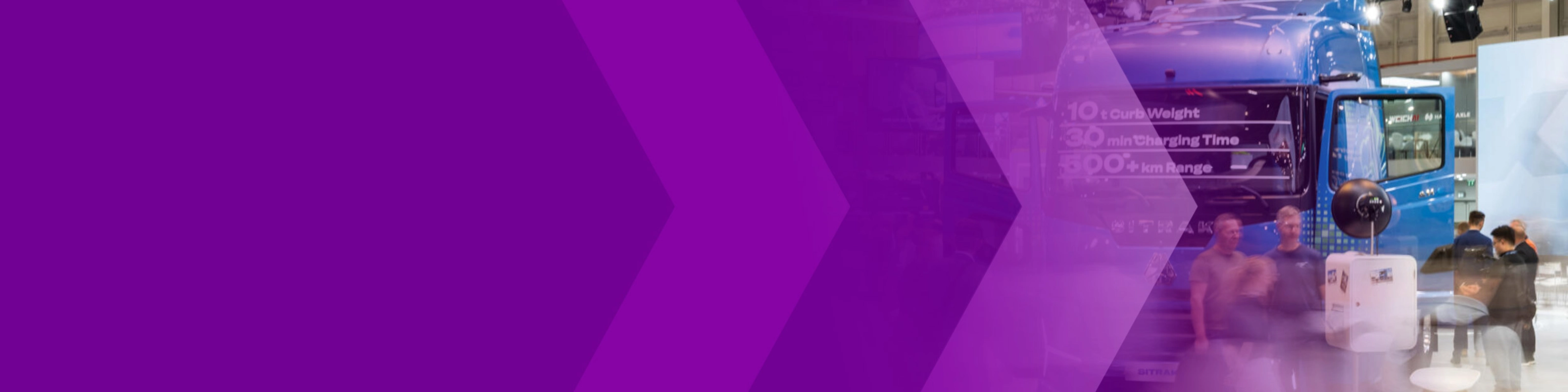 Trade show hall with a blue truck, visitors and a purple arrow graphic.