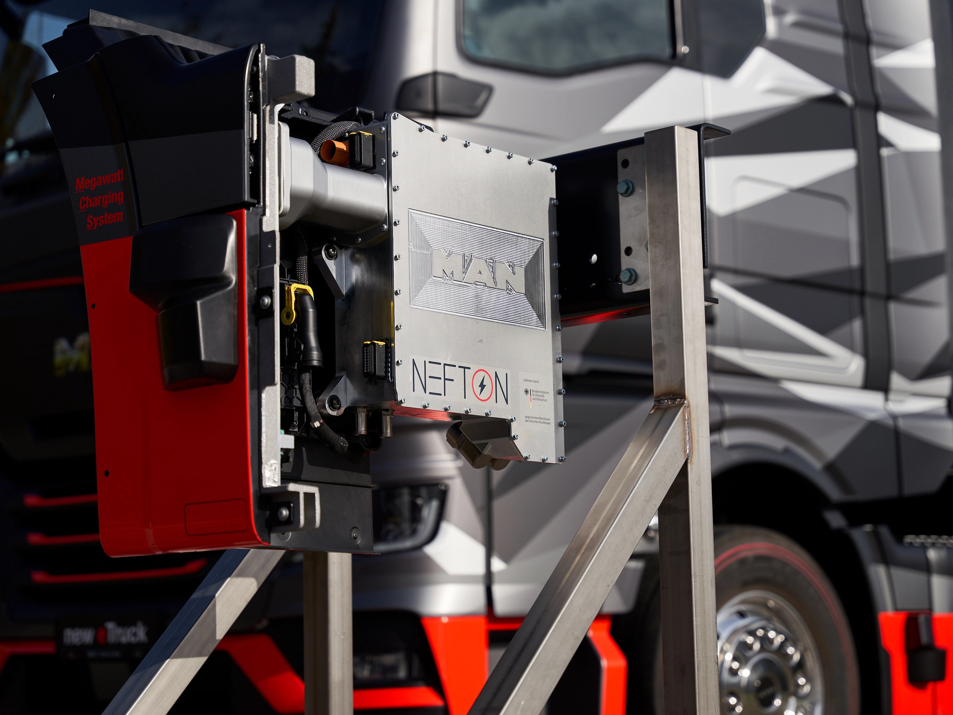 MAN Nefton megawatt charging system mounted in front of an electric truck.