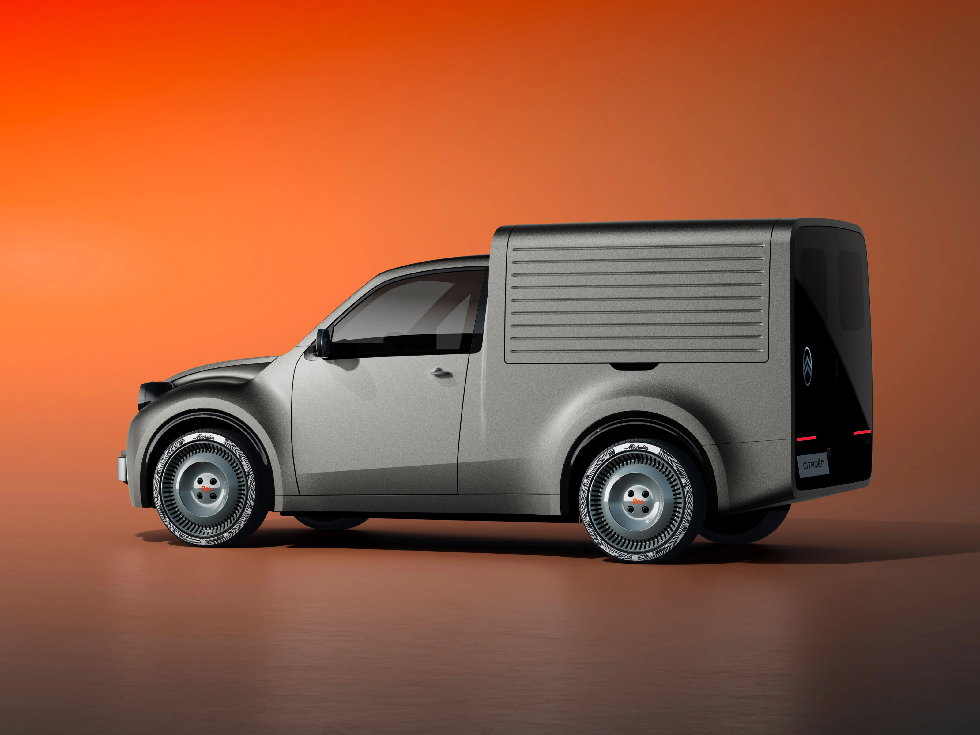 White Citroën delivery van in side view against an orange background.