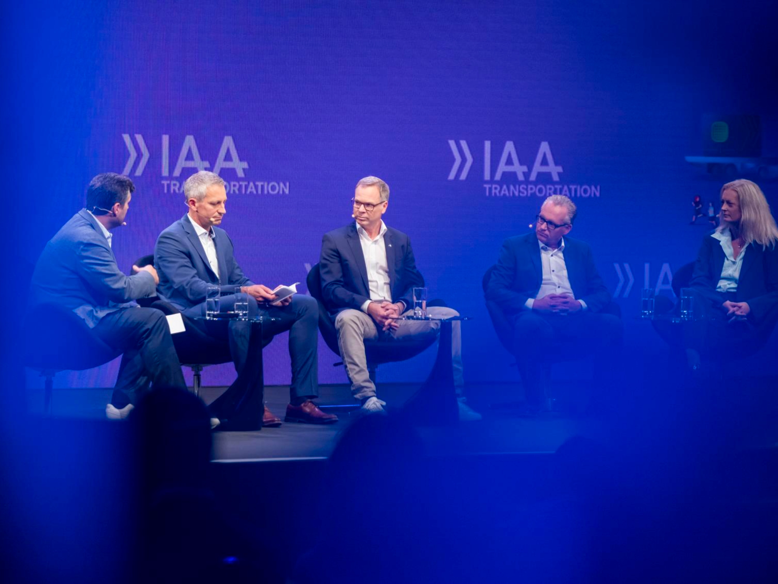 Five participants discuss on stage at IAA Transportation.