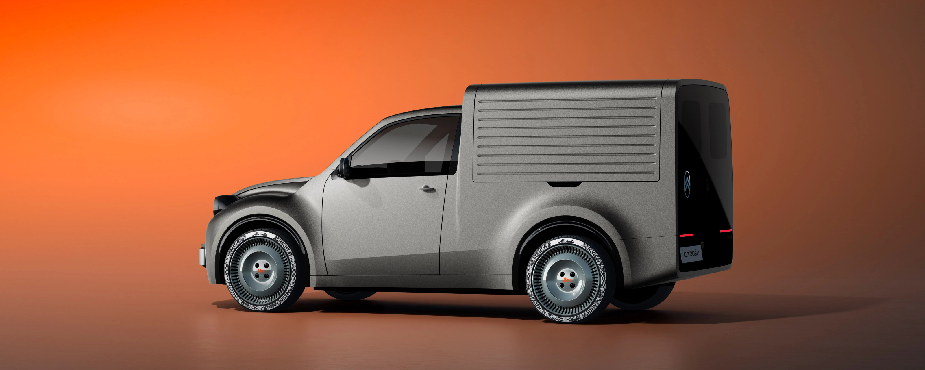 White Citroën delivery van in side view against an orange background.