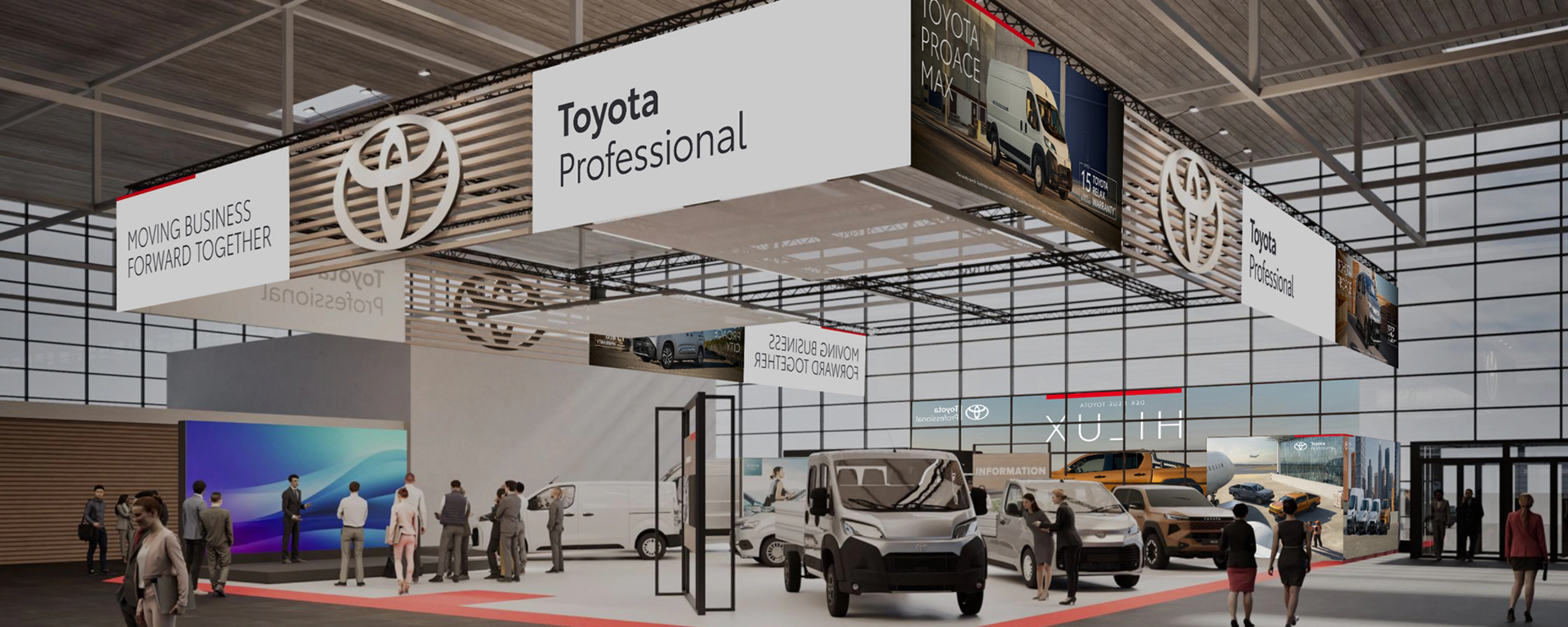 Toyota Professional exhibition stand with commercial vehicles and visitors at a trade fair.
