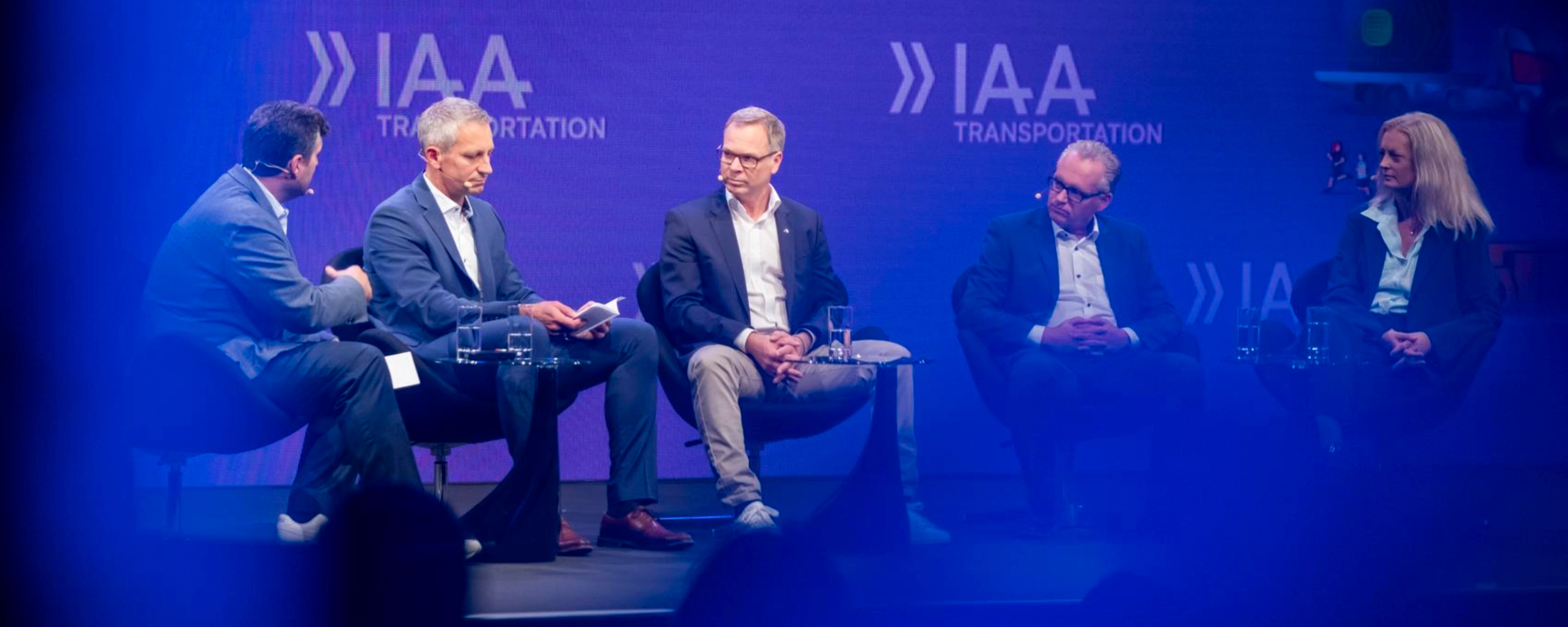 Five participants discuss on stage at IAA Transportation.