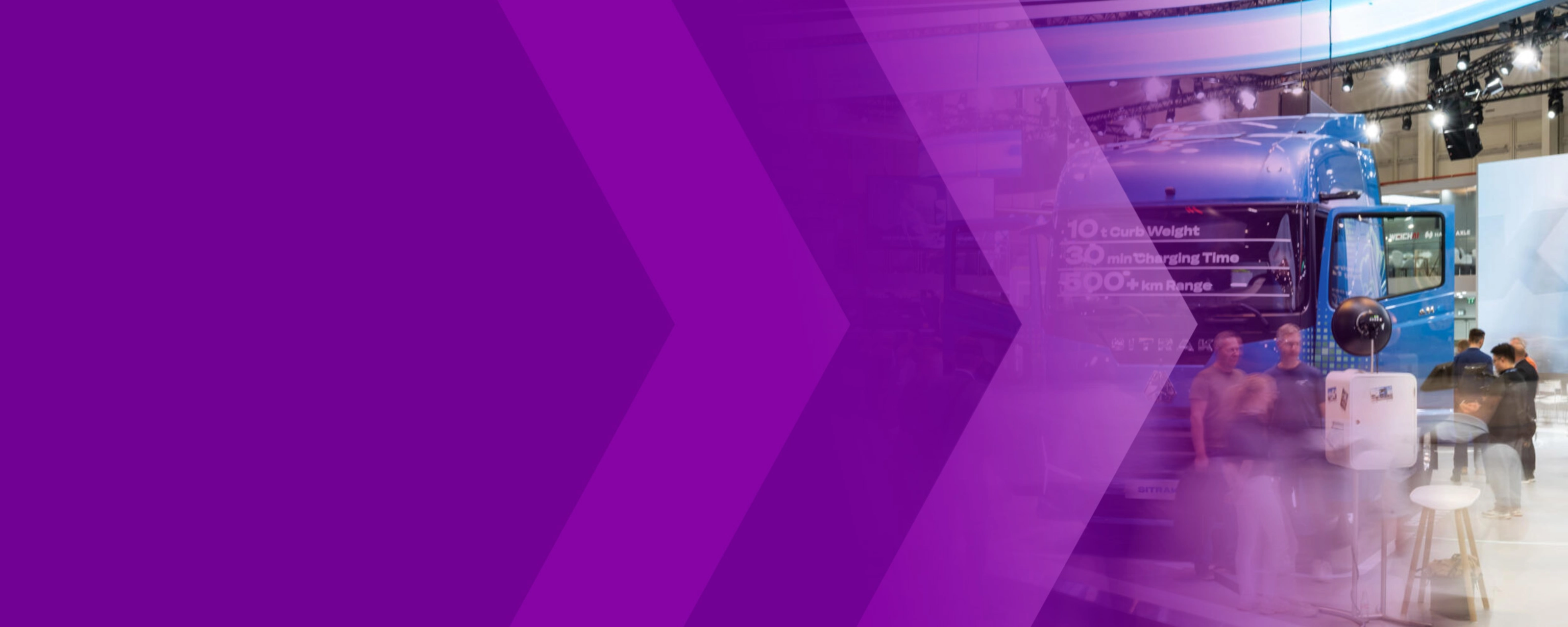 Trade show hall with a blue truck, visitors and a purple arrow graphic.