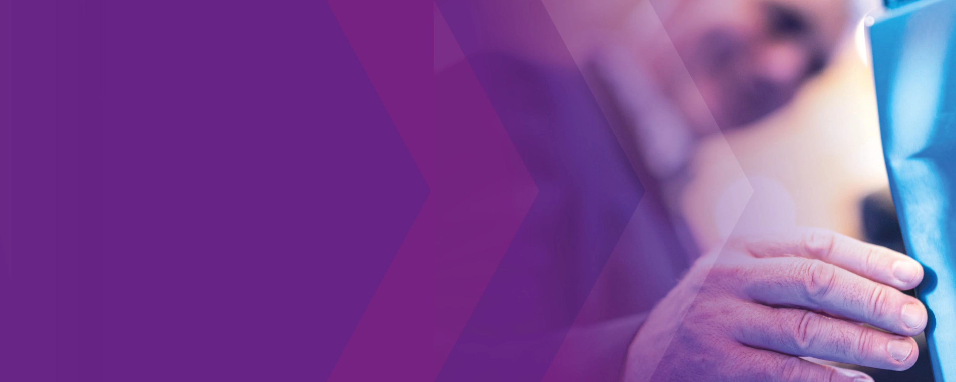 Man touching a vehicle component, purple overlay on the left.