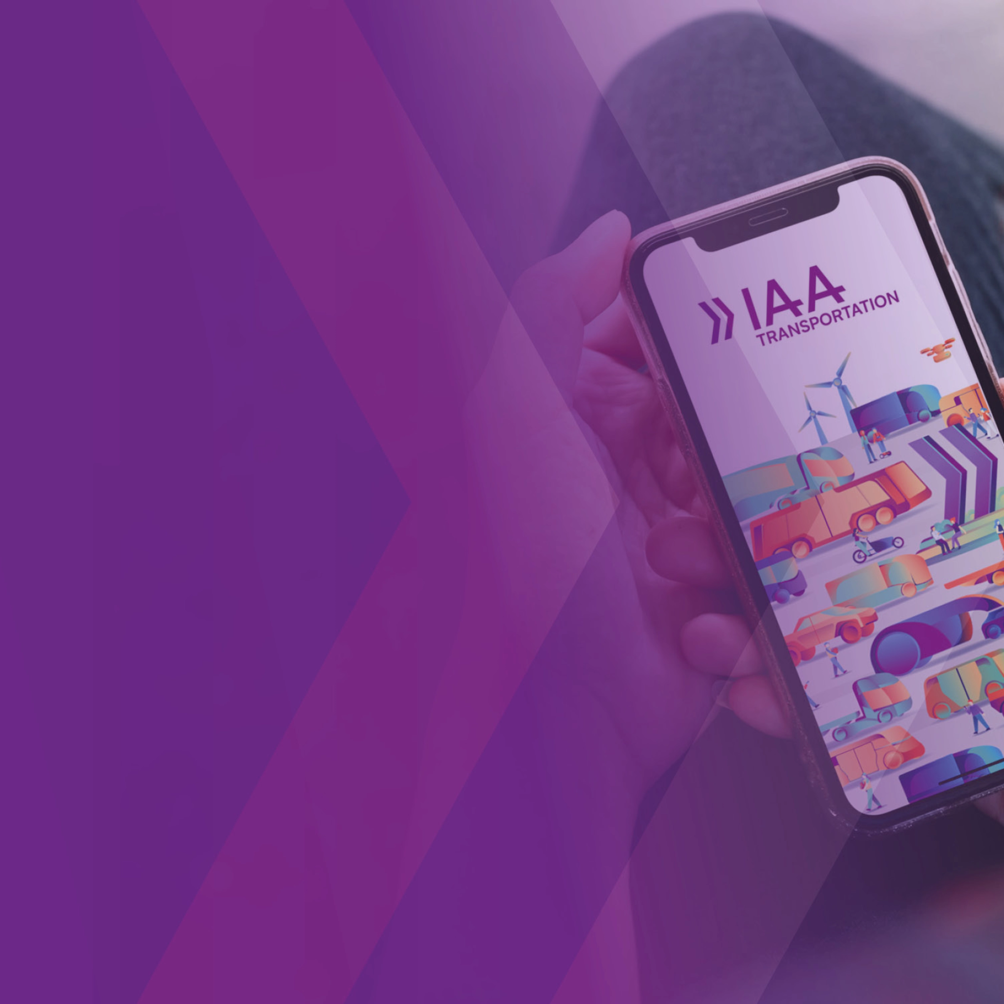 A person holds a smartphone showing a colorful app screen with the text IAA.