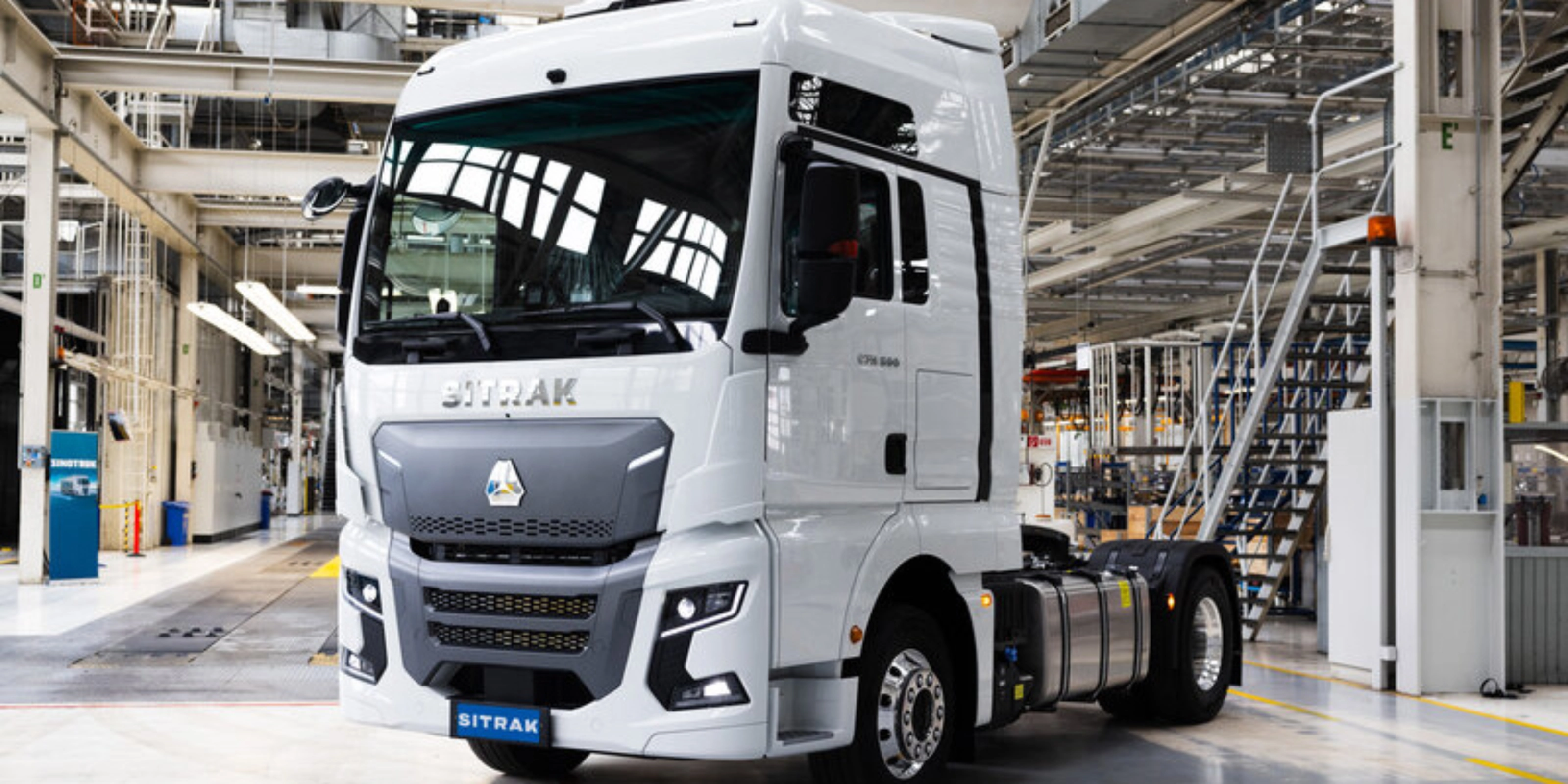 SITRAK truck cab standing inside a modern production hall.
