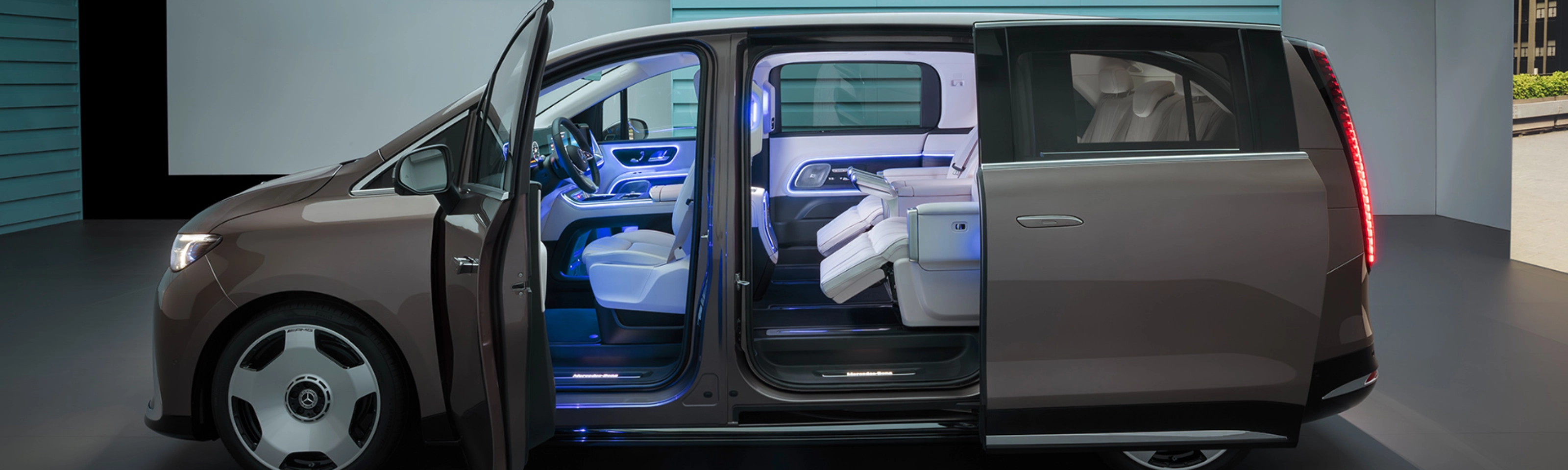Mercedes-Benz VLE with open sliding door showing interior seats.