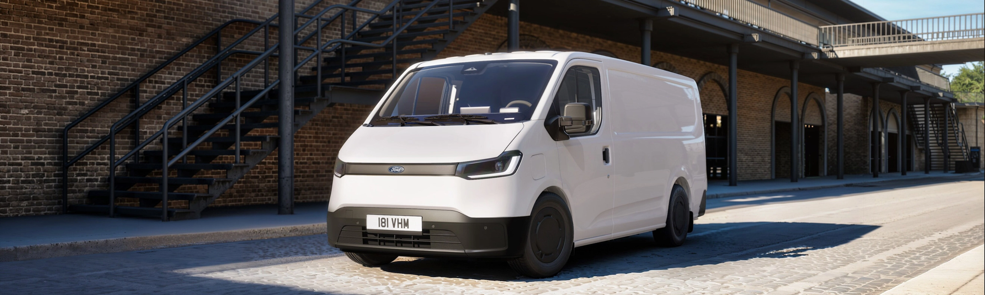 Ford Pro cargo van parked in a courtyard between historic buildings.