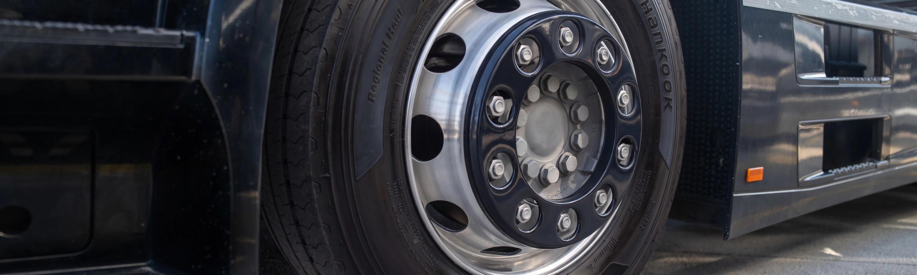 Close-up of a Hankook truck tire mounted on a wheel.