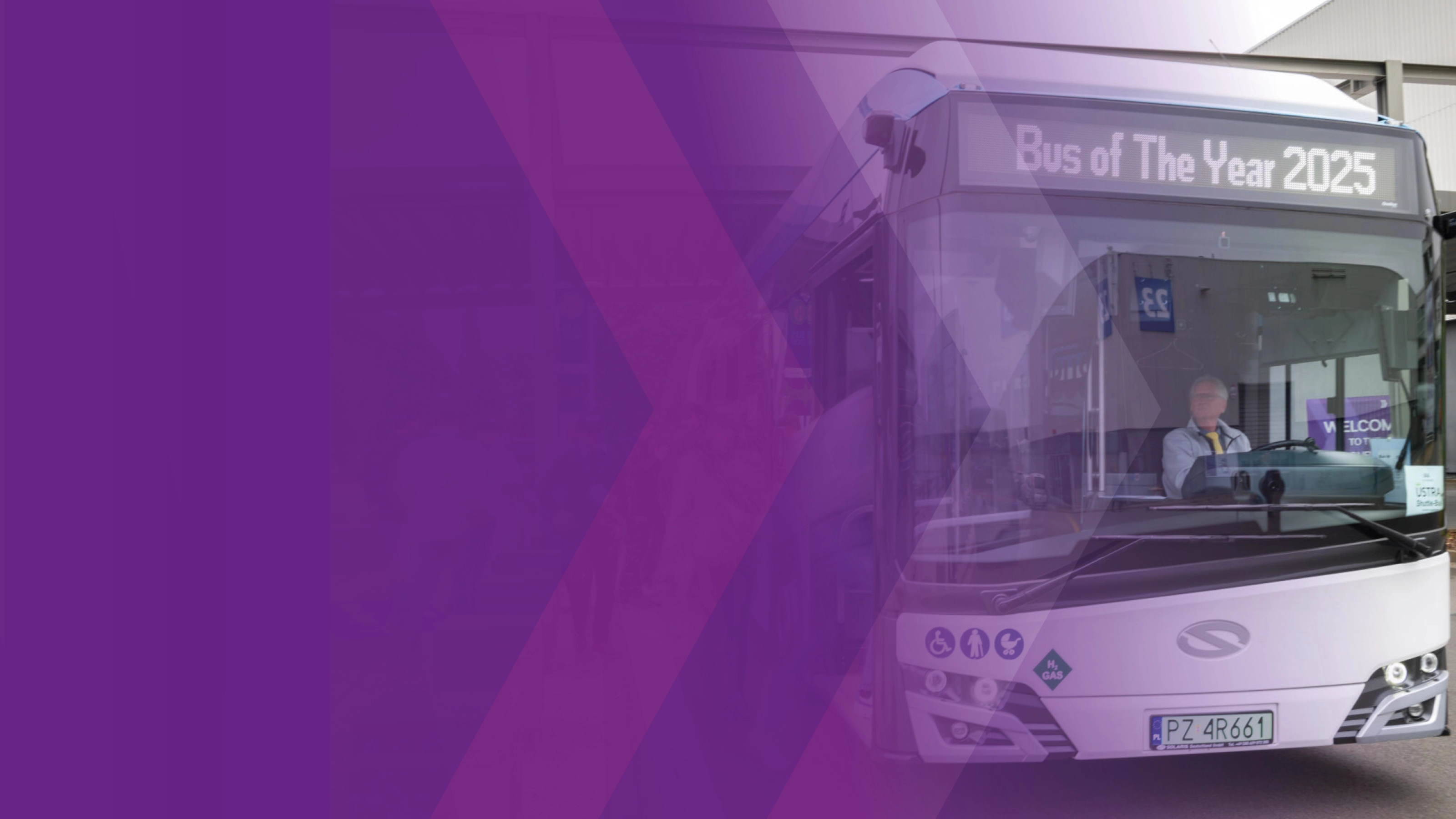 Bus with driver and display reading “Bus of The Year 2025”.