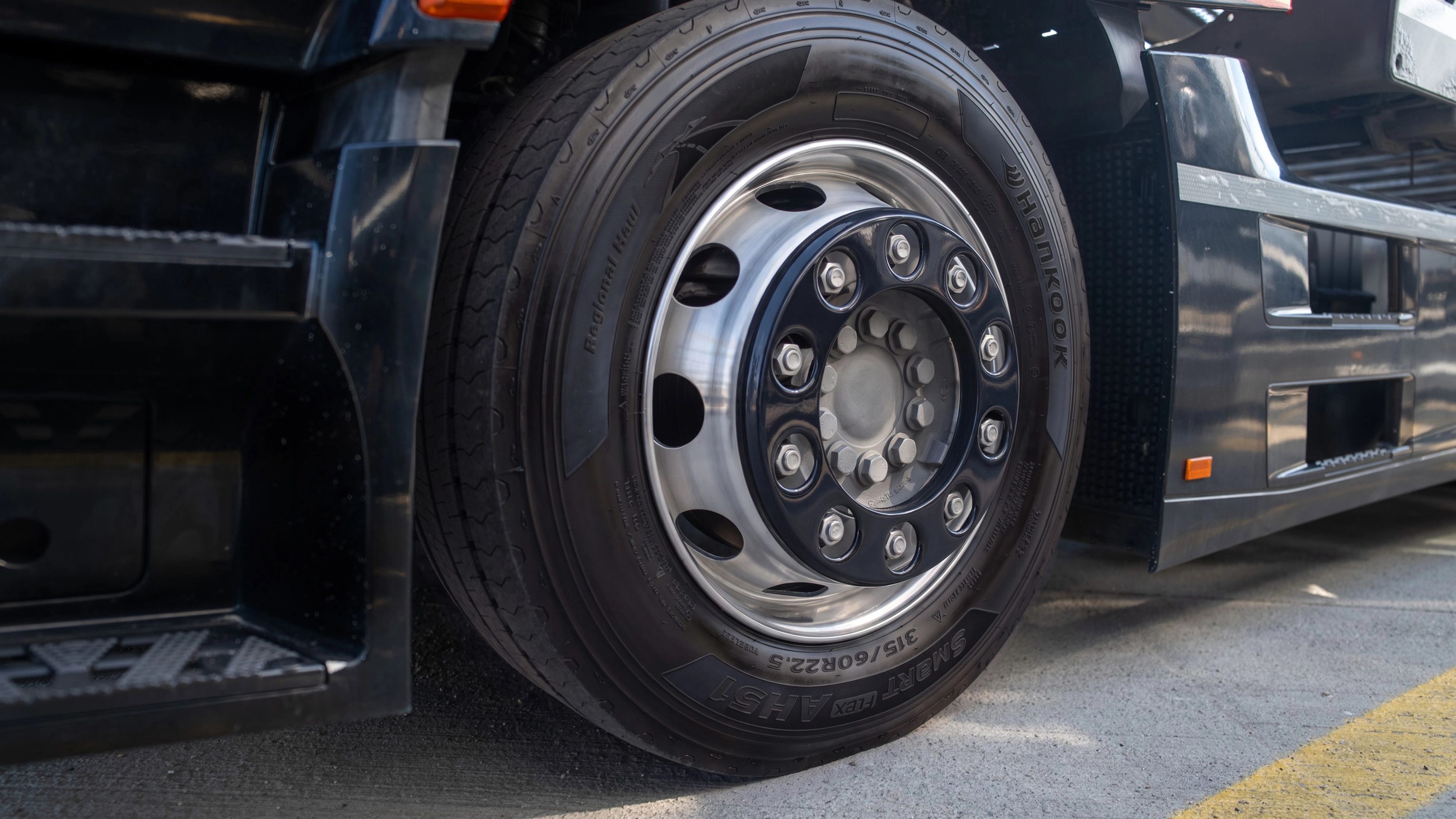 Close-up of a Hankook truck tire mounted on a wheel.