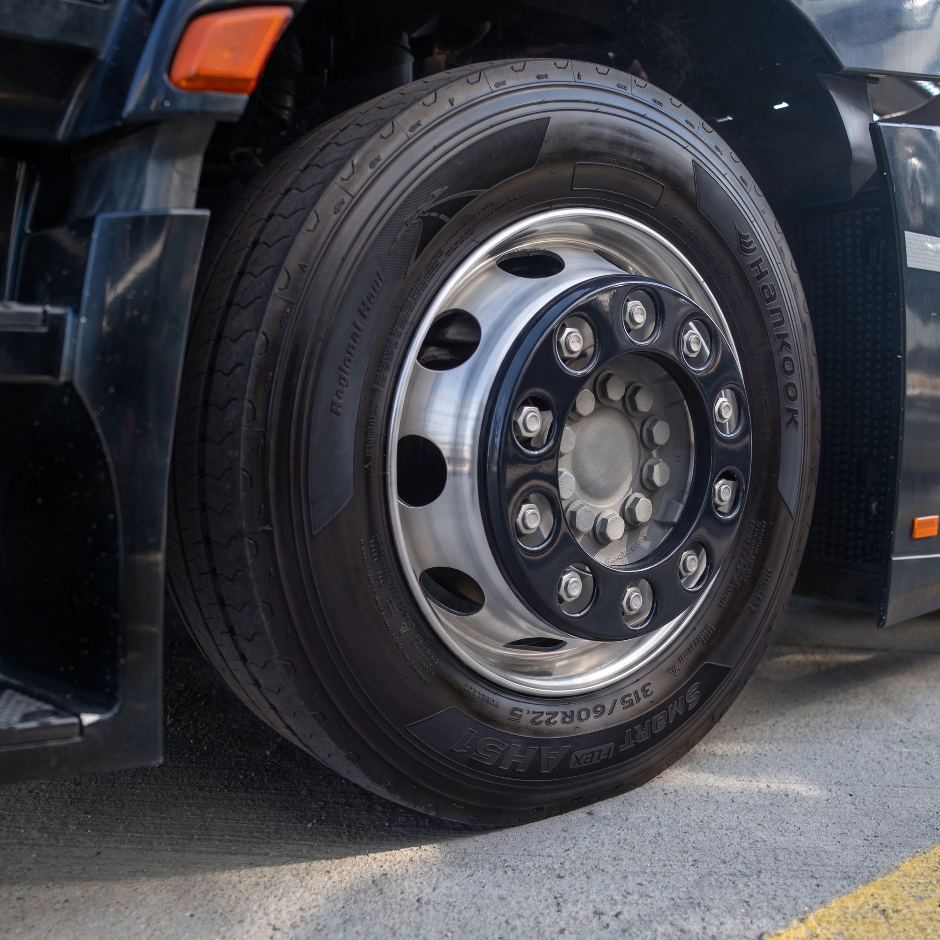 Close-up of a Hankook truck tire mounted on a wheel.