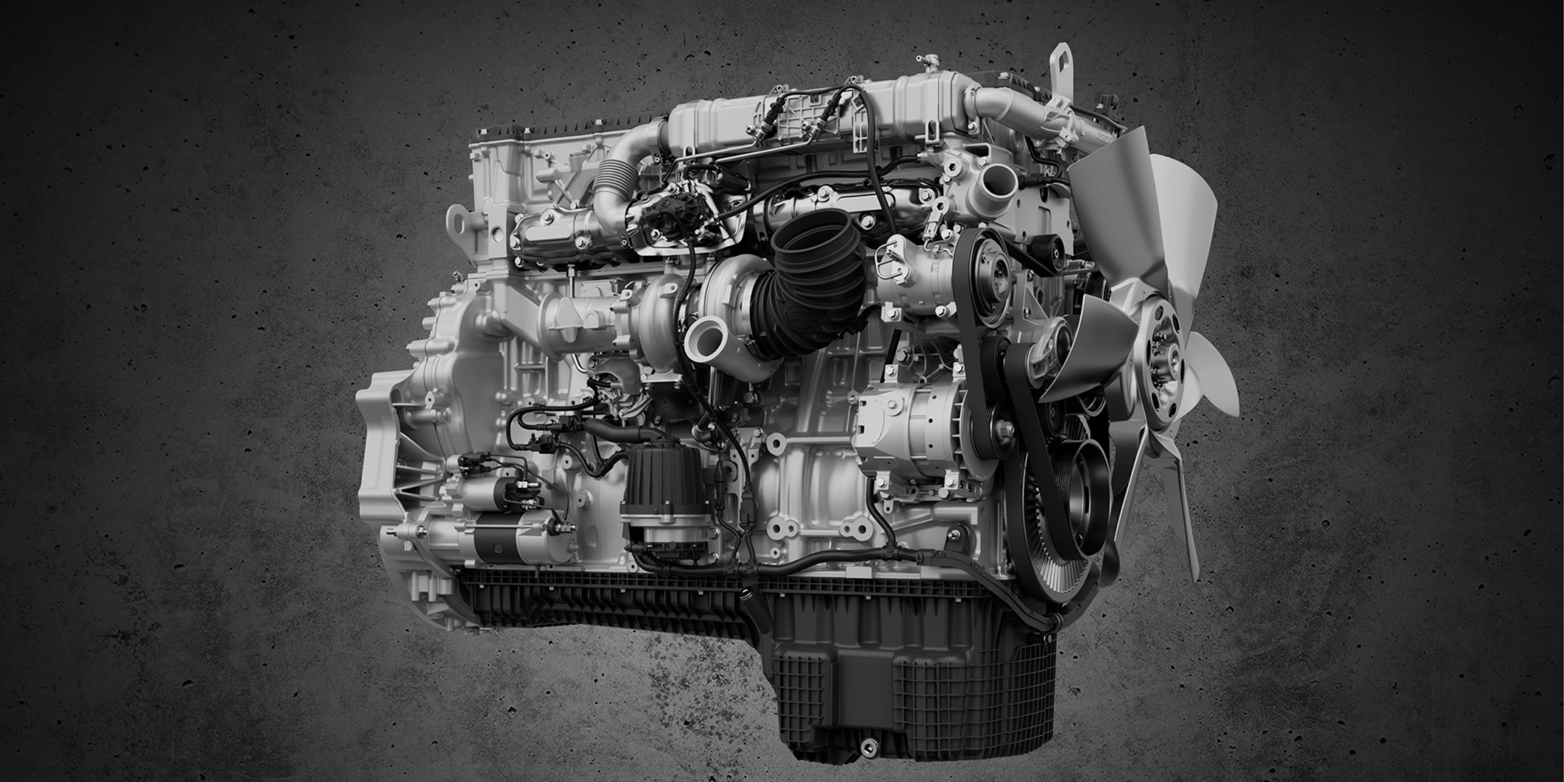 Detailed view of a truck engine with fan and visible components.