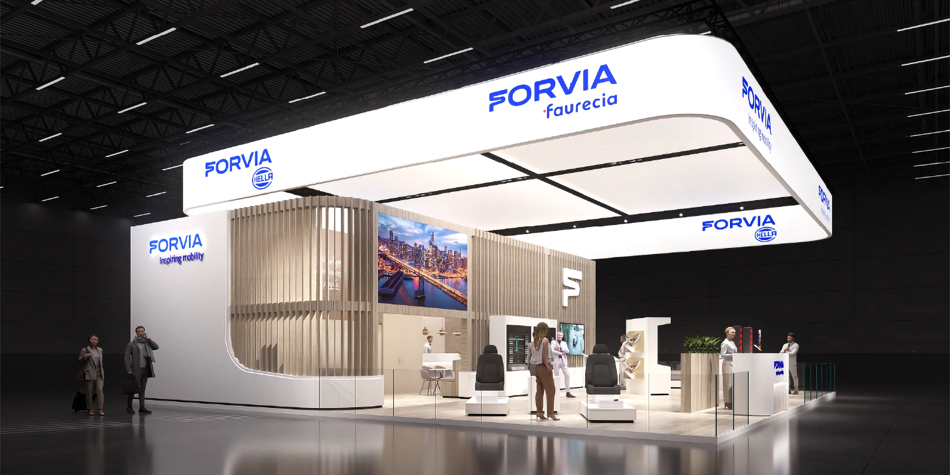 FORVIA-Messestand mit Ausstellungsflächen und Besprechungsbereichen.