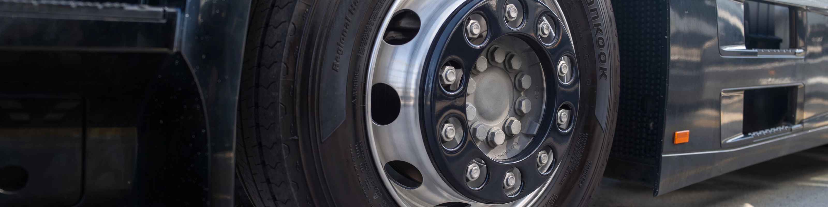 Close-up of a Hankook truck tire mounted on a wheel.