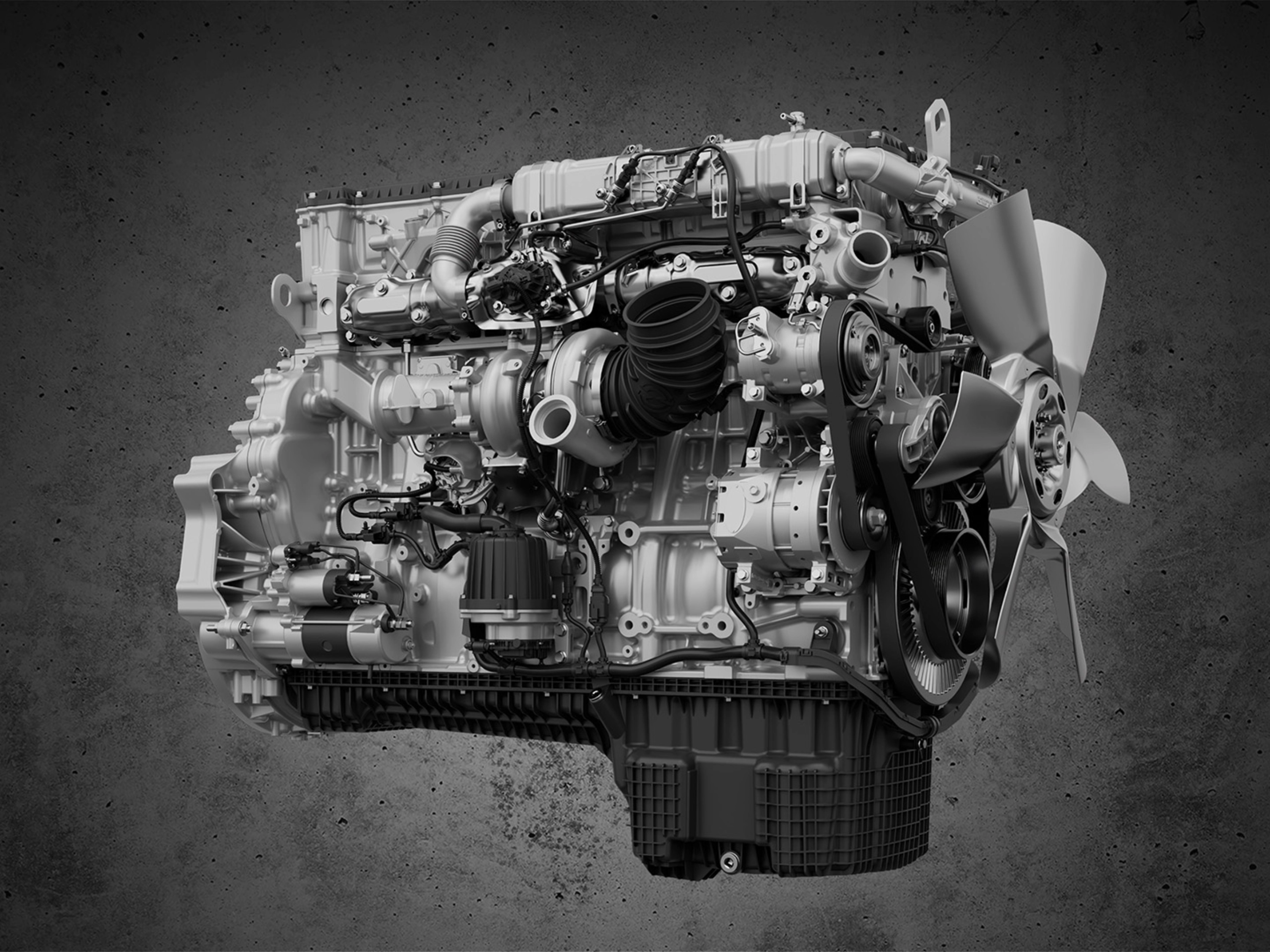 Detailed view of a truck engine with fan and visible components.