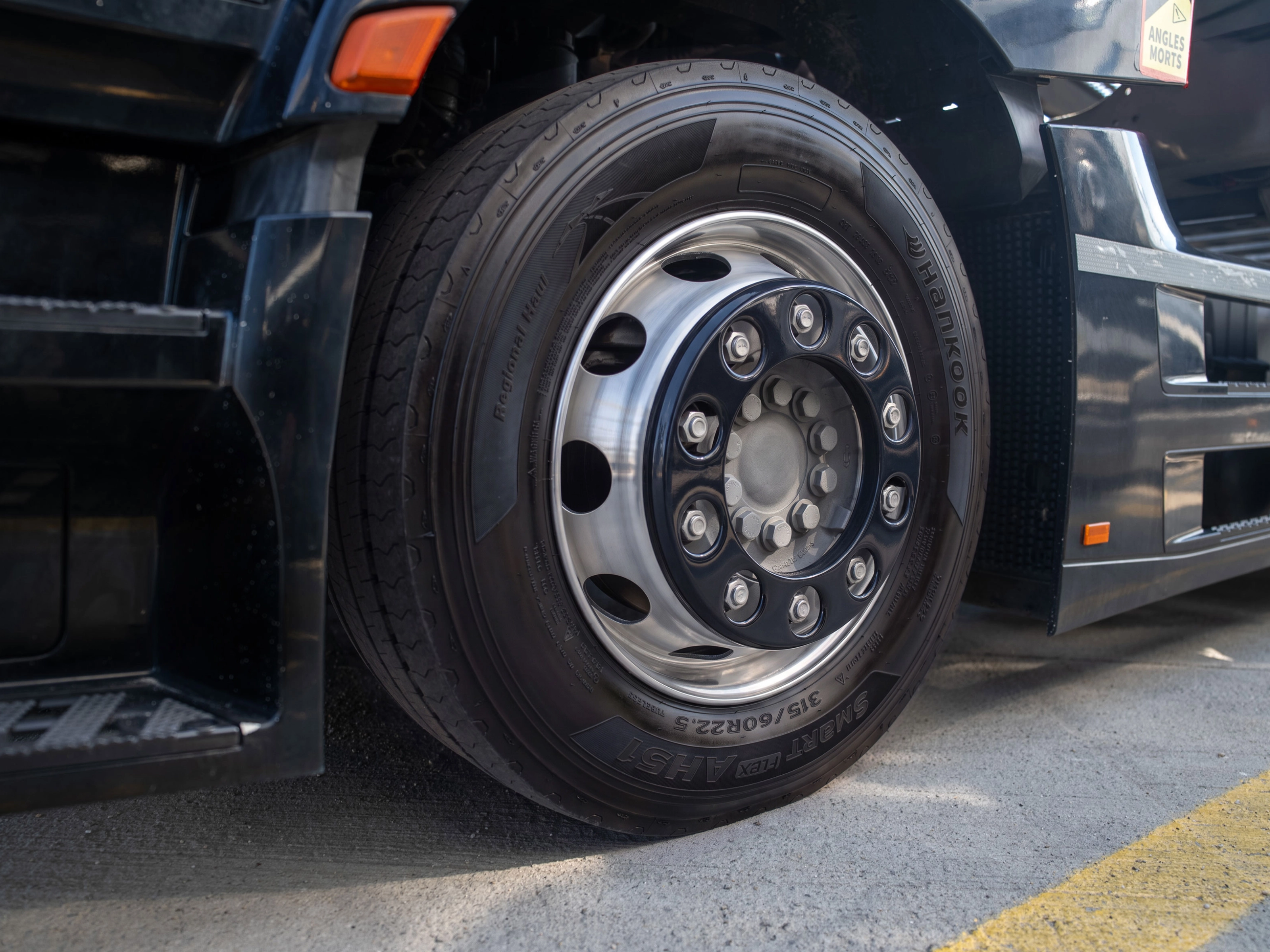 Close-up of a Hankook truck tire mounted on a wheel.