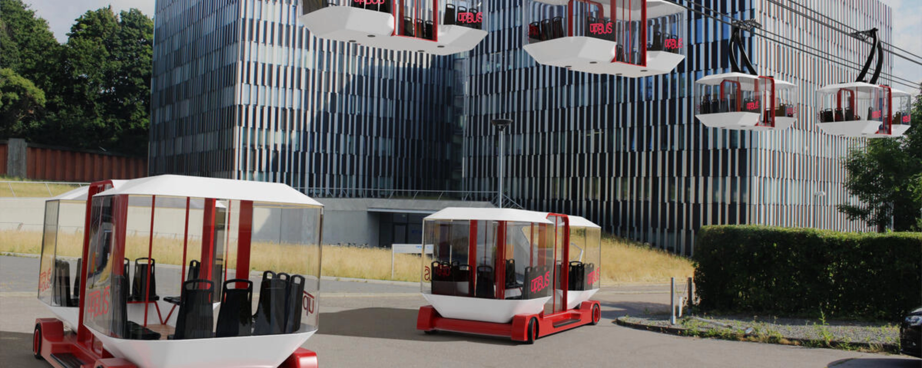 Moderne Seilbahnen und Bodenfahrzeuge des upBUS-Systems stehen vor Bürogebäuden.