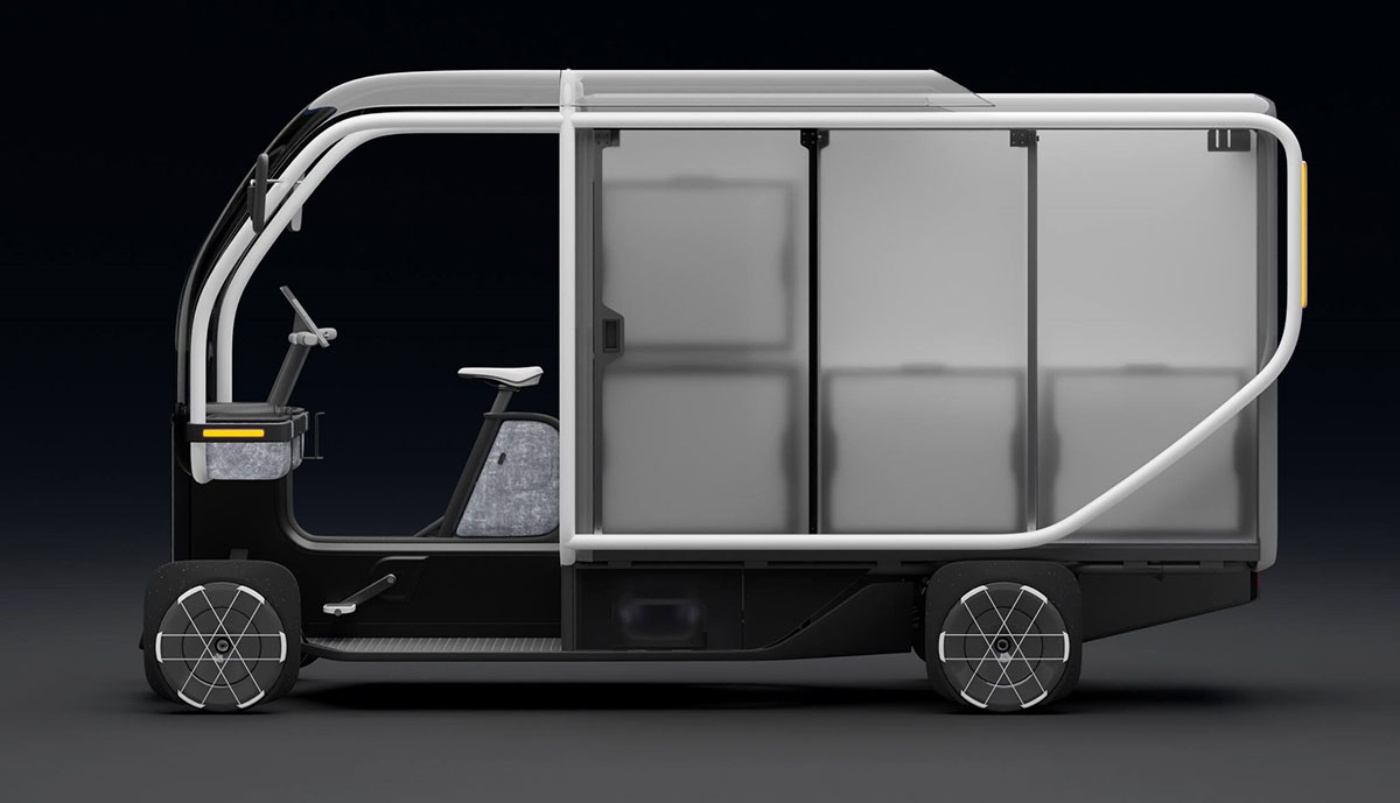 Futuristisches elektrisches Lastenfahrrad mit Kabine und Laderaum in Seitenansicht.