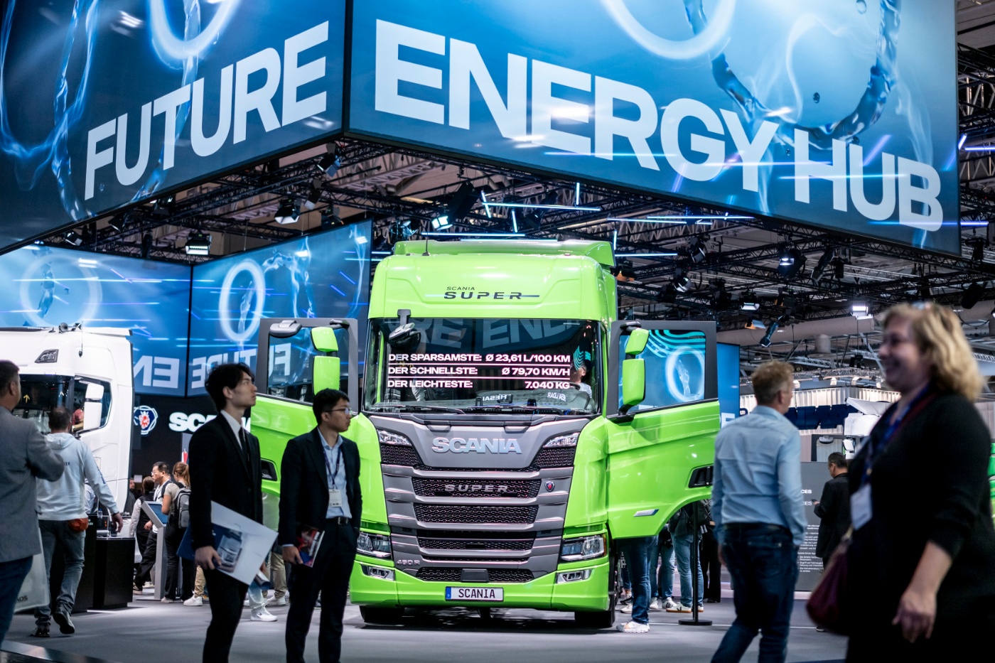 Green Scania Super truck displayed under the “Future Energy Hub” sign at a trade show.