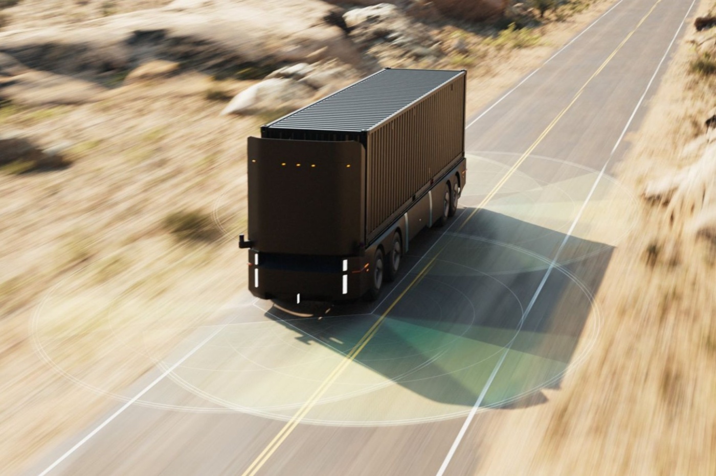 Autonomous electric truck driving on a rural road.