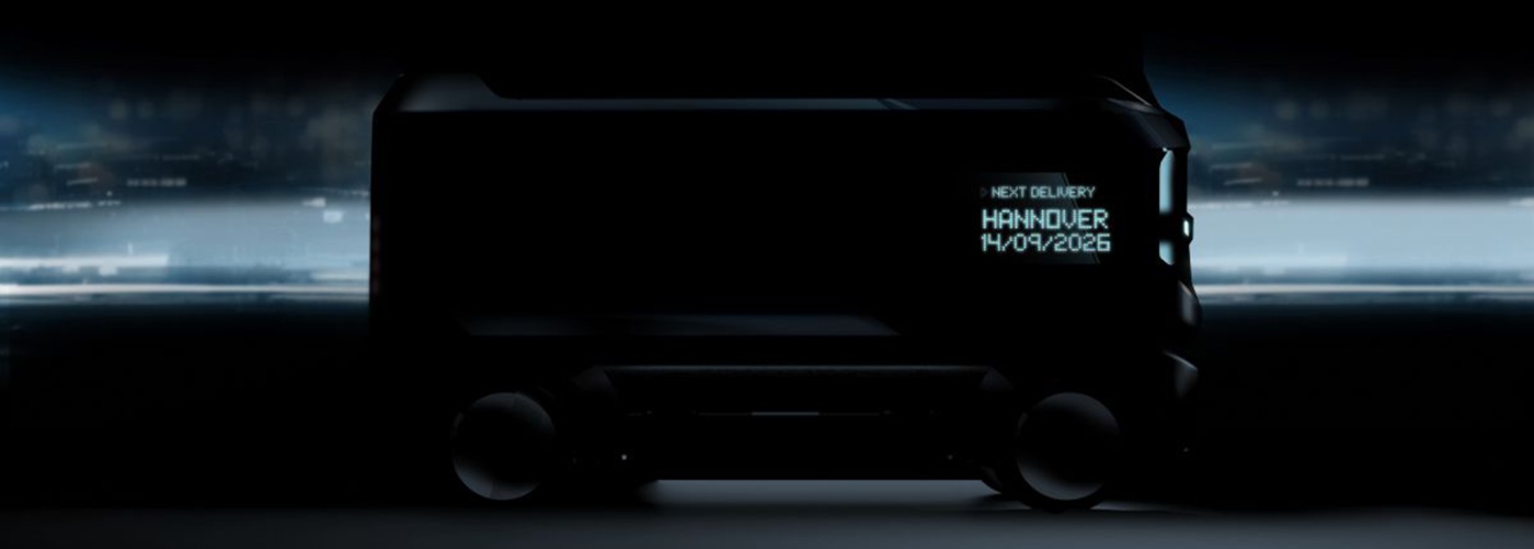 Dark delivery vehicle with display showing next delivery to Hannover on 14/09/2026.