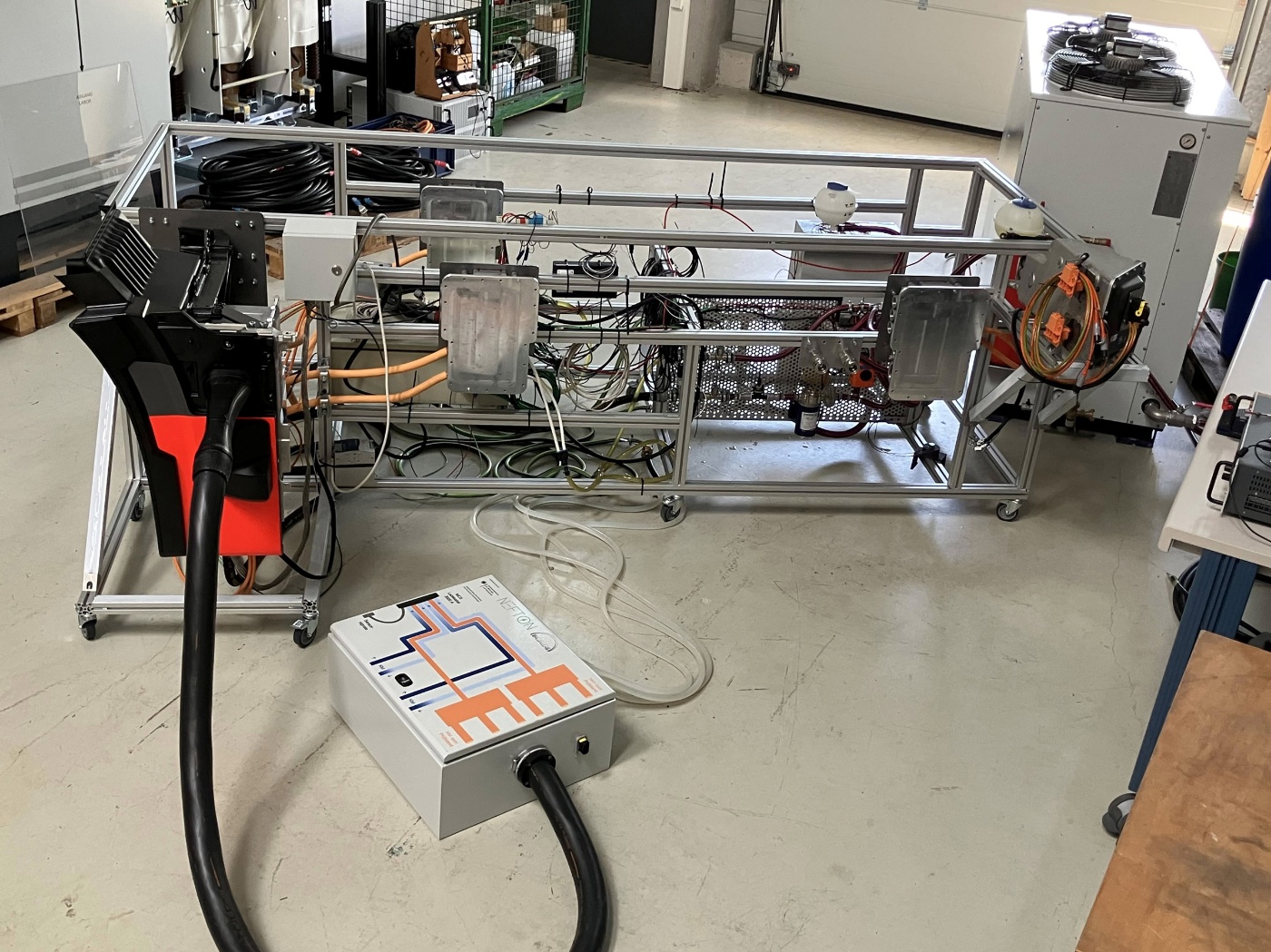 MAN Nefton megawatt charging system prototype in a workshop.