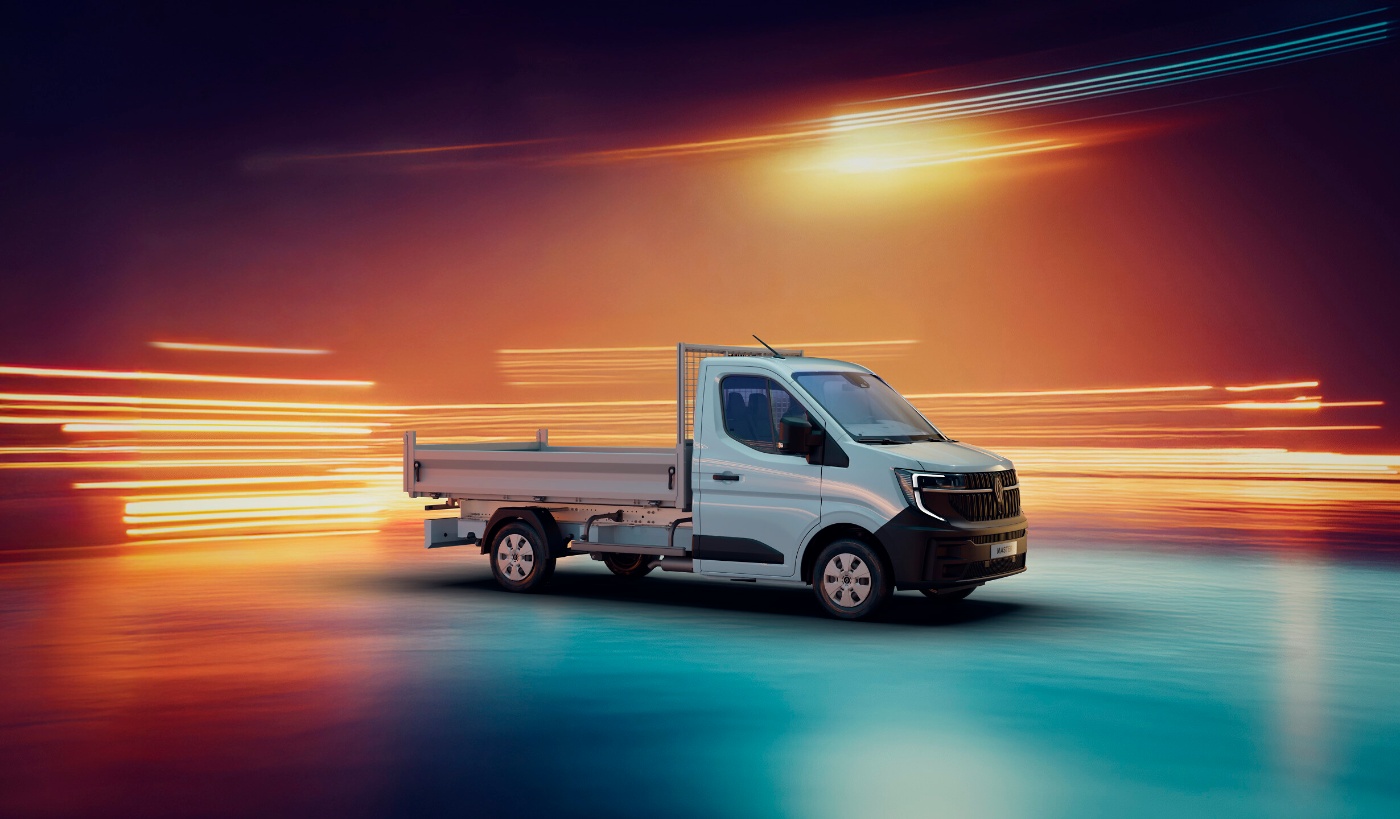 Grey Renault flatbed truck on display against a light trail background.