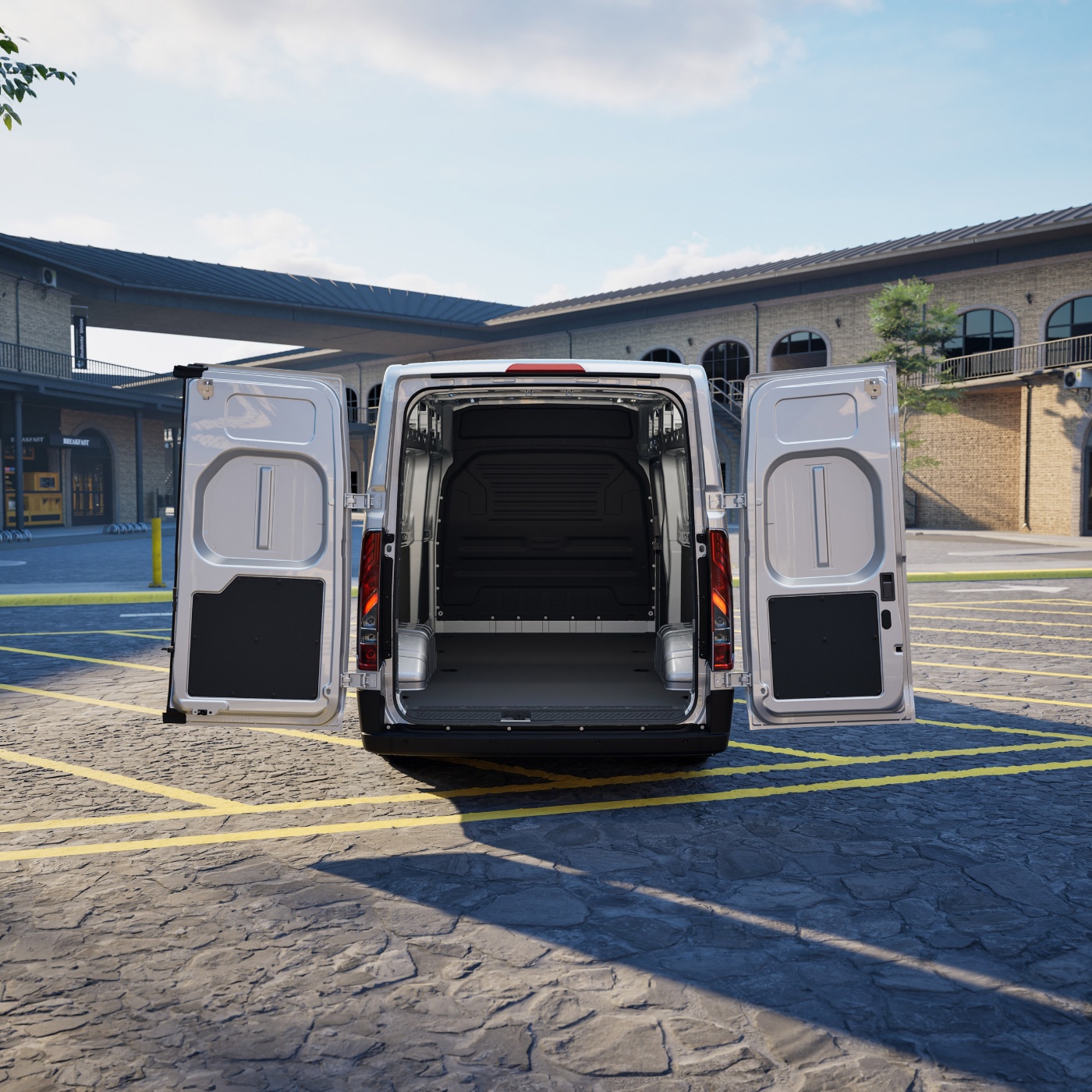 Ford Pro cargo van with rear doors open, showing the empty loading area.