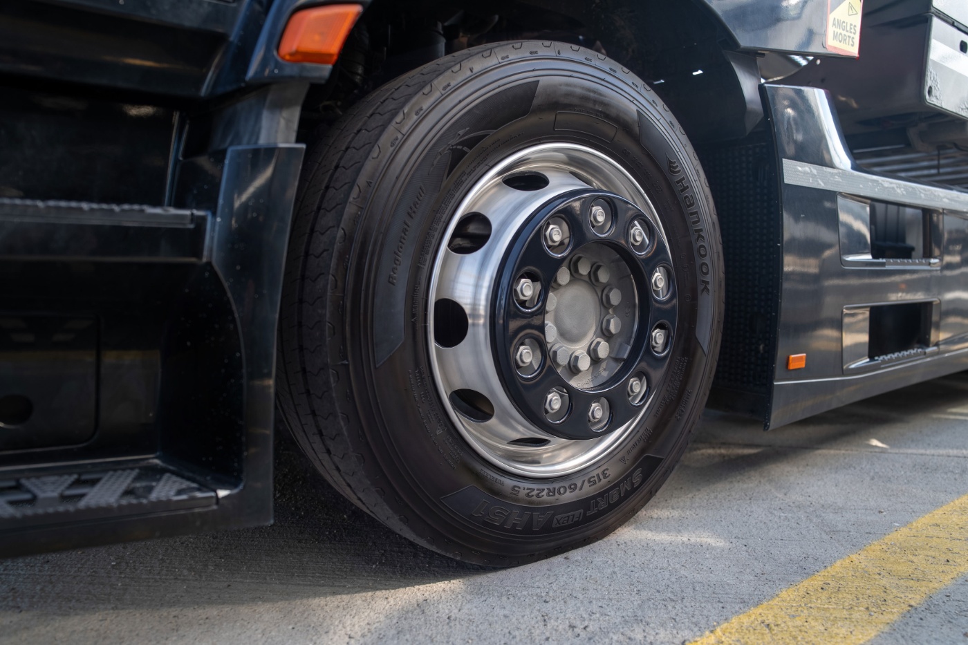 Close-up of a Hankook truck tire mounted on a wheel.