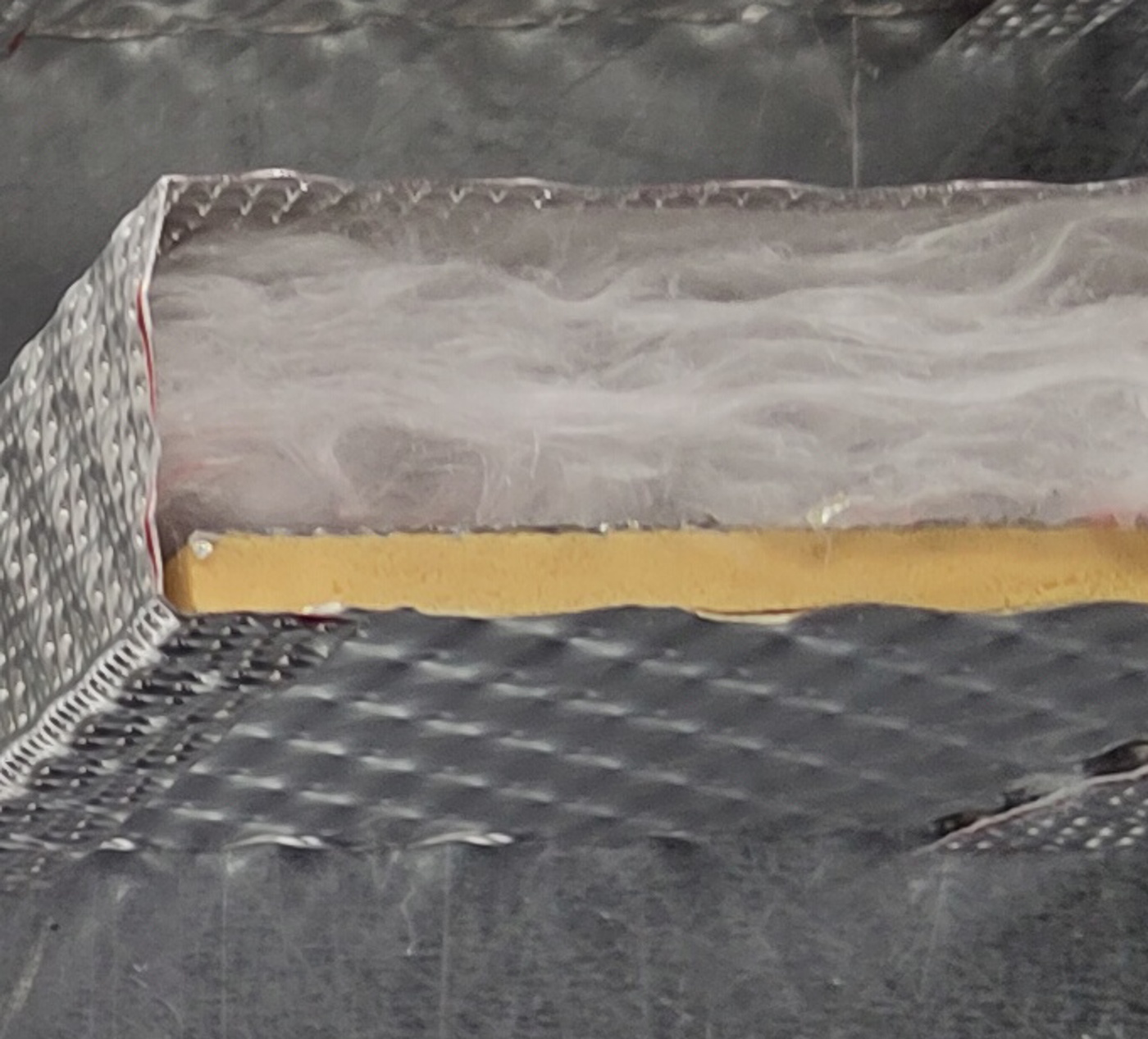 InsituCore heat and acoustic panel shown in a cross-sectional view.